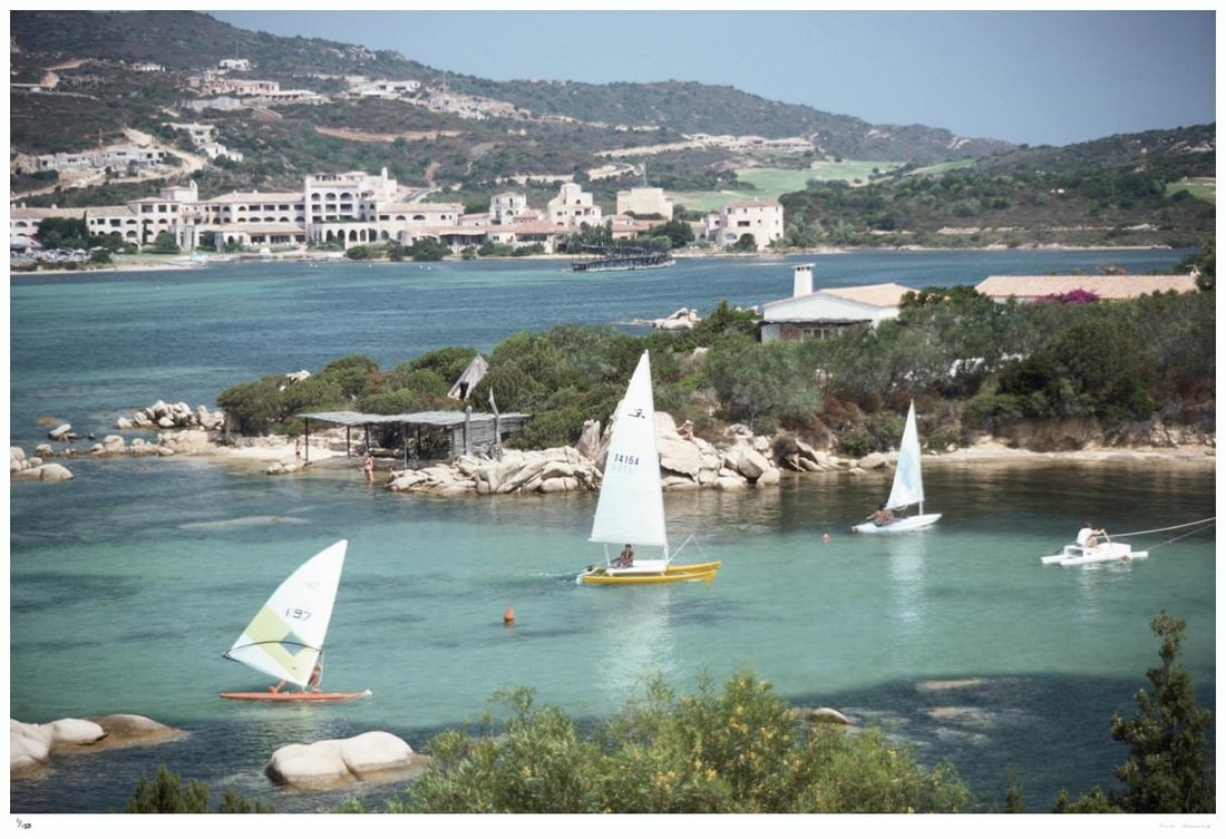 Costa Smeralda, Sardinia 1978 - Slim Aarons Estate Stamped: 1978 (printed later): Title: Costa Smeralda, Sardinia 1978 - Slim Aarons Estate Stamped: 1978 (printed later) Description: Costa Smeralda, Sardinia 1978 - Slim Aarons Estate Stamped Sailboats on the waters of the Costa
