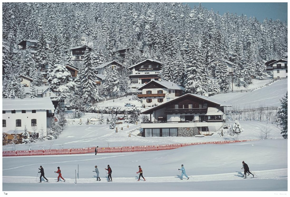 Skiing In Seefeld 1985 - Slim Aarons Estate Stamped: 1985 (printed later): Title: Skiing In Seefeld 1985 - Slim Aarons Estate Stamped: 1985 (printed later) Description: Skiing In Seefeld 1985 - Slim Aarons Estate Stamped A group of men and women go cross-country skiing in Se