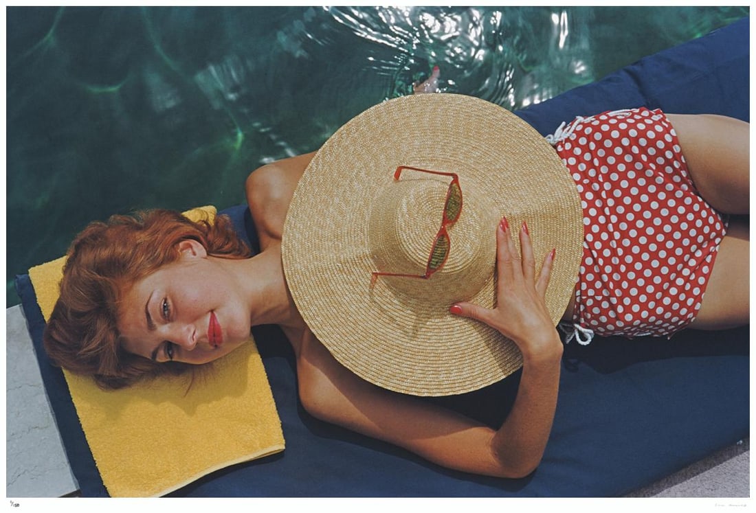 Sunbathing In Burgenstock 1955 - Slim Aarons Estate Stamped: 1955 (printed later): Title: Sunbathing In Burgenstock 1955 - Slim Aarons Estate Stamped: 1955 (printed later) Description: Sunbathing In Burgenstock 1955 - Slim Aarons Estate Stamped Lilian Hanson, sunbathing by a pool at