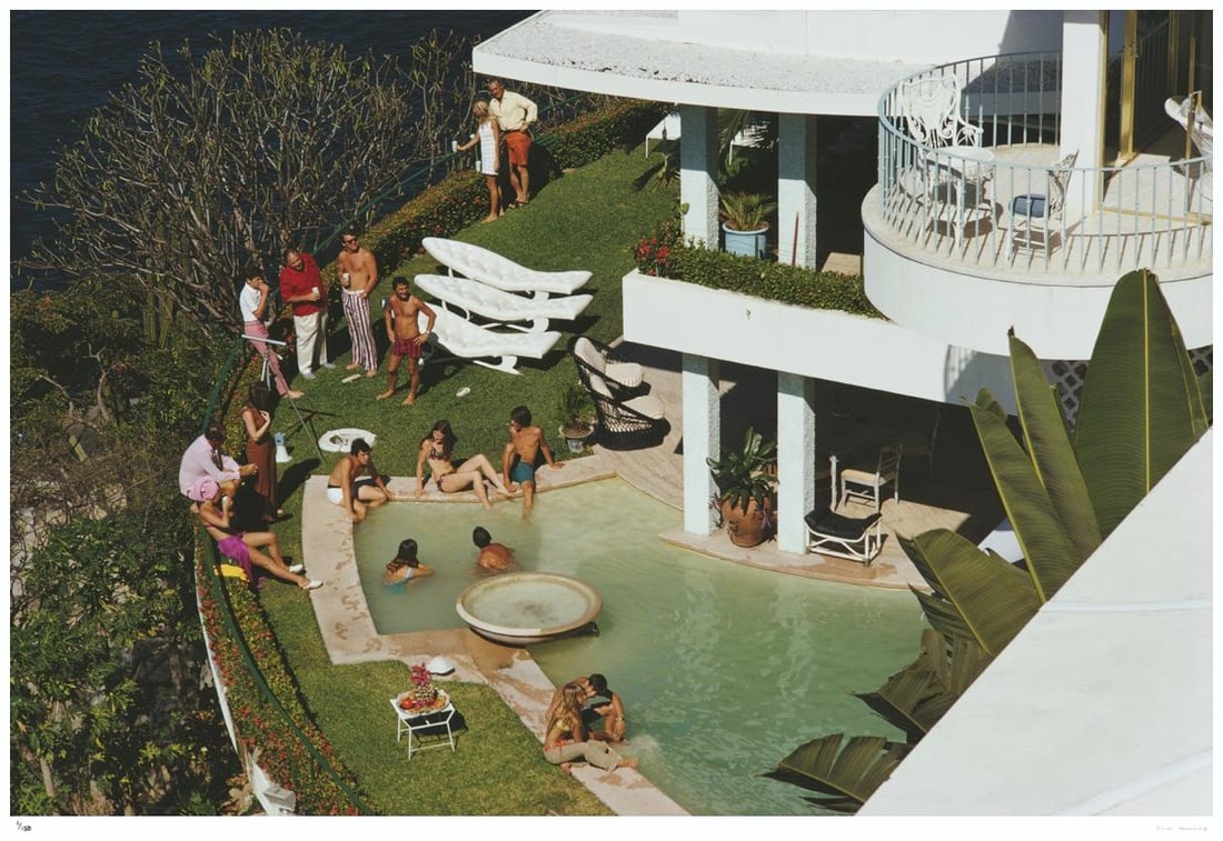 Clifftop Pool 1971 - Slim Aarons Estate Stamped: 1971 (printed later): Title: Clifftop Pool 1971 - Slim Aarons Estate Stamped: 1971 (printed later) Description: Clifftop Pool 1971 - Slim Aarons Estate Stamped Guests around the clifftop pool at Warren Avis’ villa