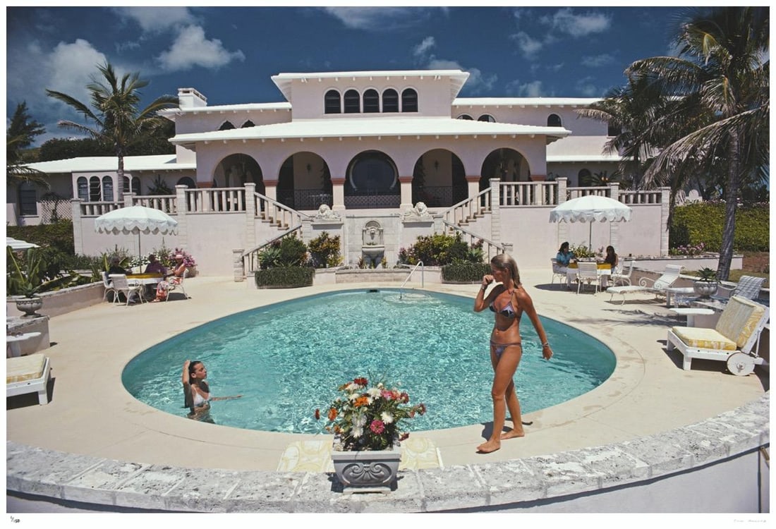 Elephant Walk 1977 - Slim Aarons Estate Stamped: 1977 (printed later): Title: Elephant Walk 1977 - Slim Aarons Estate Stamped: 1977 (printed later) Description: Elephant Walk 1977 - Slim Aarons Estate Stamped Guests around the pool at Elephant Walk, Duncan McMartin’