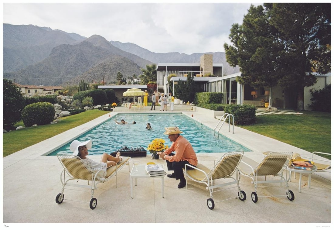 Poolside Interruptions 1970 - Slim Aarons Estate Stamped: 1970 (printed later): Title: Poolside Interruptions 1970 - Slim Aarons Estate Stamped: 1970 (printed later) Description: Poolside Interruptions 1970 - Slim Aarons Estate Stamped Lita Baron talking with a guest at a poolsid