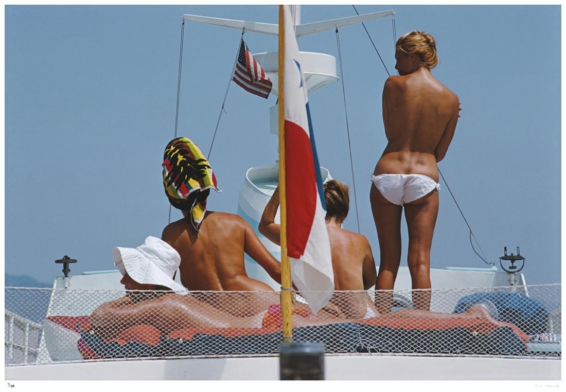 Yacht Holiday 1967 - Slim Aarons Estate Stamped: 1967 (printed later): Title: Yacht Holiday 1967 - Slim Aarons Estate Stamped: 1967 (printed later) Description: Yacht Holiday 1967 - Slim Aarons Estate Stamped Tanned bodies on the deck of Dino Pecci Blunt’s yacht in