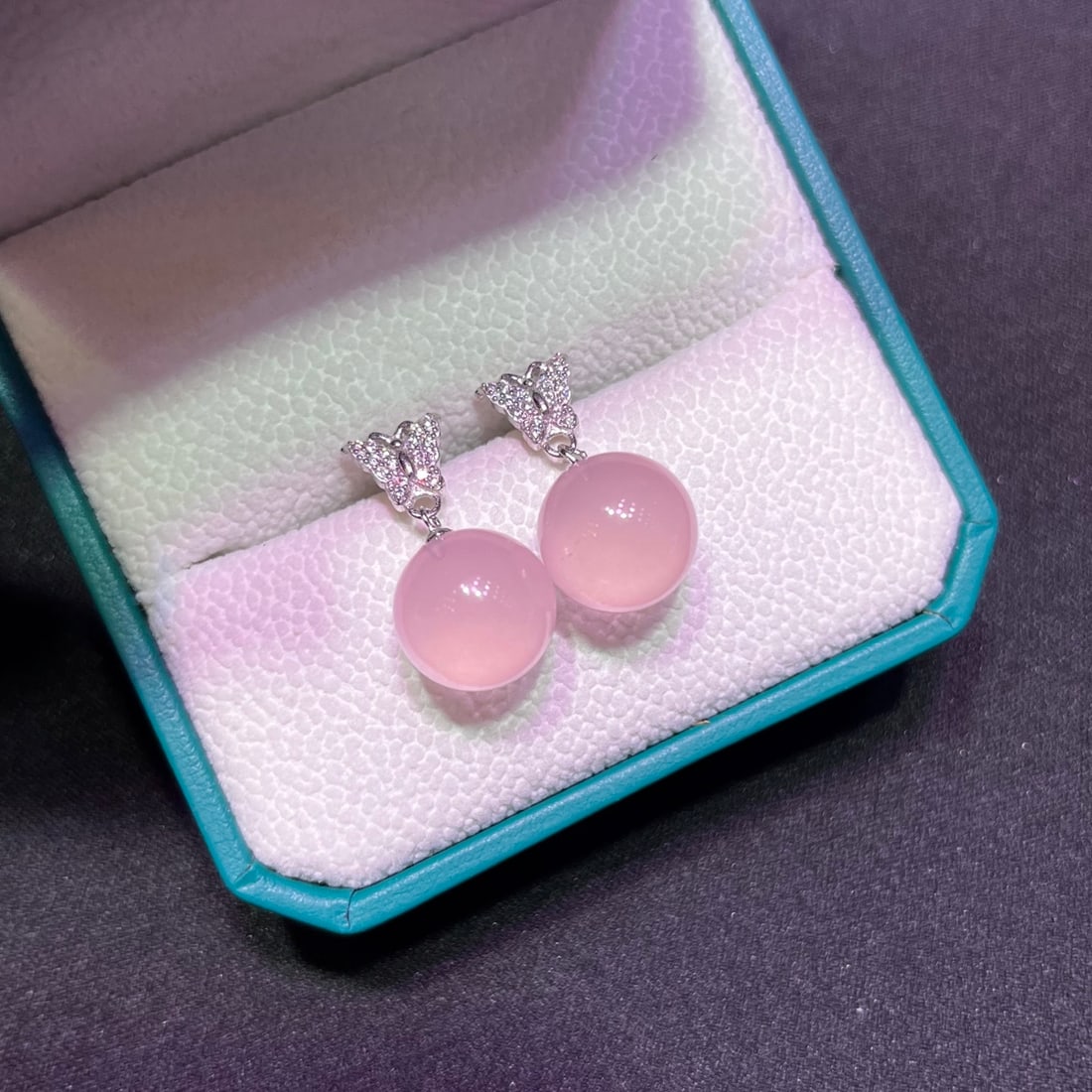 Natural Mozambique Pink Crystal Lucky Bead Earrings: Natural Mozambique pink crystal lucky charm earrings, exquisitely set in S925 silver, elegant and sophisticated. Reserve: $300.00 Shipping:Domestic: Shipping rates are determined by