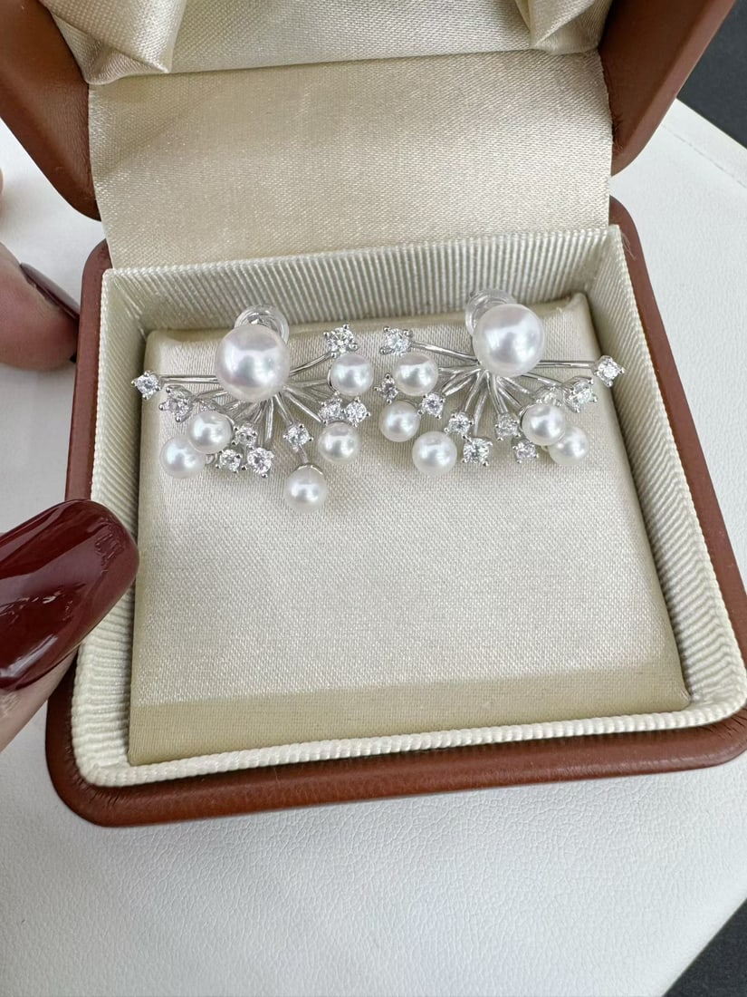 Pearl Earrings with Fireworks Design, Wearable in Two Styles: Sterling Silver Inlay 4-6mm Aurora Akoya Pearl Reserve: $150.00 Shipping:Domestic: Shipping rates are determined by destinationInternational: Foreign shipping rates are determined by destination.