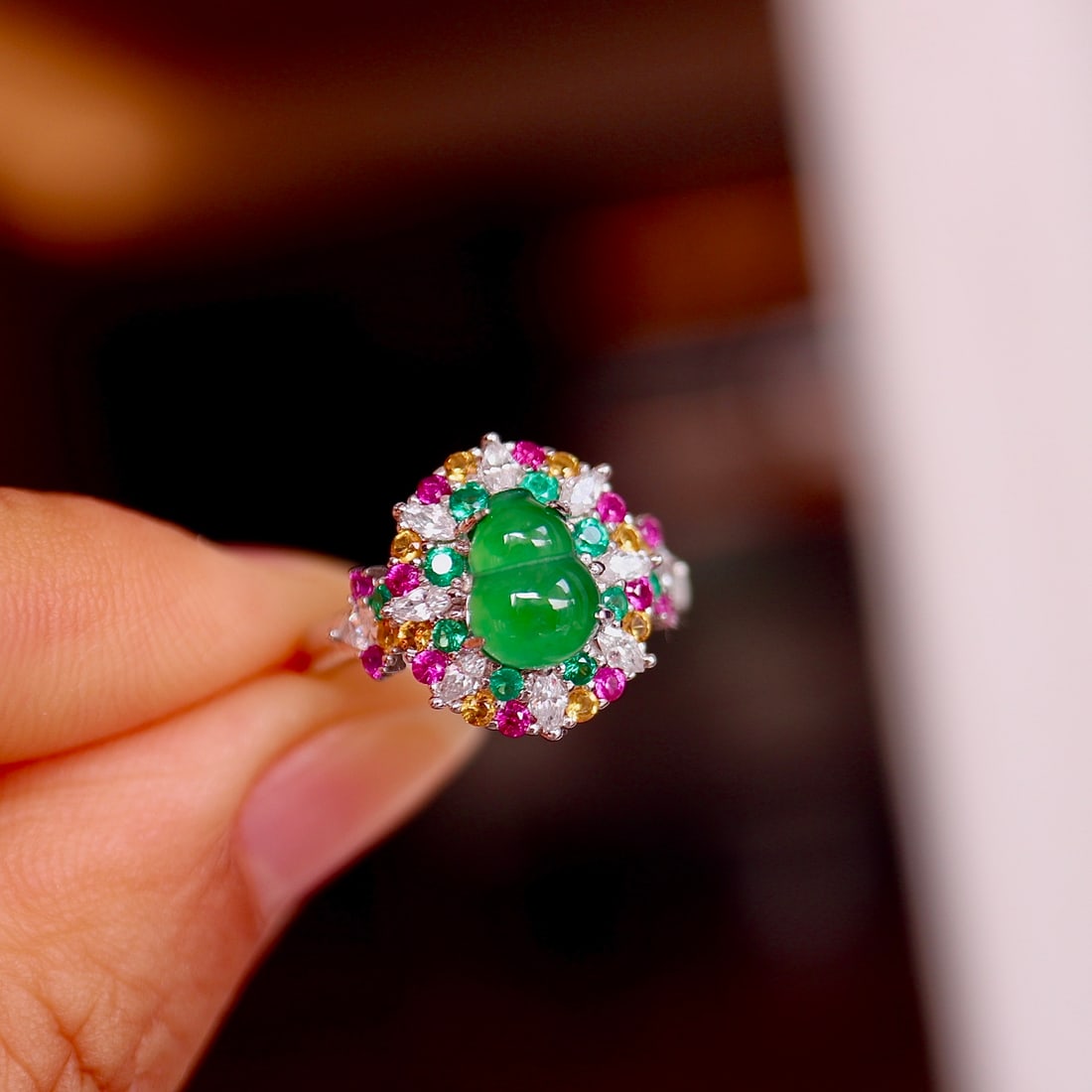 Natural Jade Gourd Ring: Natural jadeite gourd ring, approximately 6x8mm gourd. Decorated with cultured rubies and green beryls, approximately 8mm S925 sterling silver setting Reserve: $150.00 Shipping:Domestic: Shipping