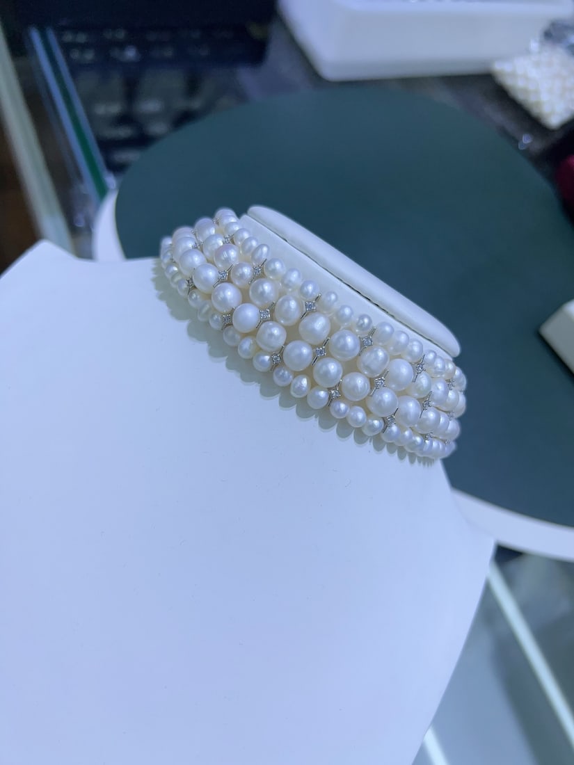Natural White Pearl Necklace: Natural White Pearl 5-8mm, near-round and bright, without tail chain, 35cm in length Reserve: $350.00 Shipping:Domestic: Shipping rates are determined by destinationInternational: Foreign shipping