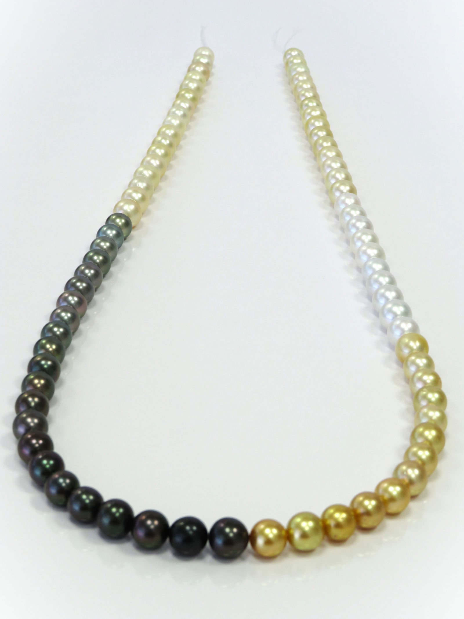 10mm Round Mix Tahitian and White/Golden South Sea Pearl Long Necklace: Title:10mm Round Mix Tahitian and White/Golden South Sea Pearl Long Necklace Description:AA-AAA Grade High luster, Round Mix White/Golden South Sea and Tahitian, with minimal spots/blemishes, 77