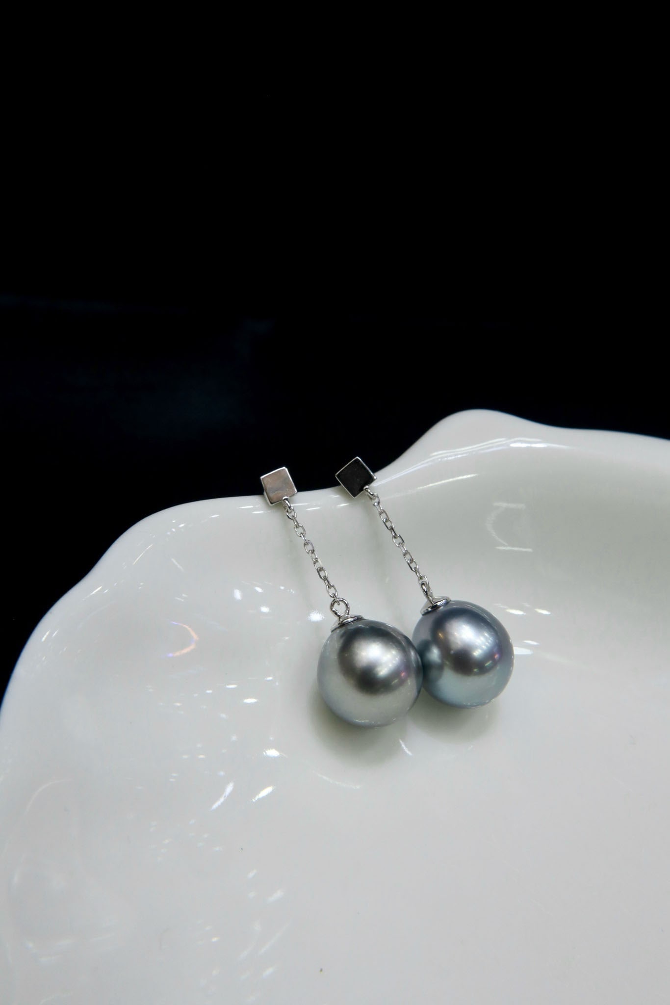 Tahitian Sea Platinum Grey Pearl Earrings: Tahitian seawater platinum grey pearl earrings. Earring size: 9-10mm, near round, high luster, minor blemishes, set in 18K gold. Simplicity is classic. Reserve: $1,200.00 Shipping:Domestic: