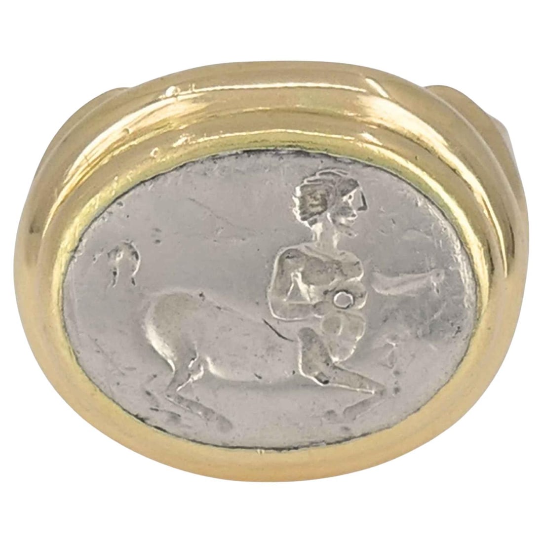 Vintage Bvlgari 18k Gold Ancient Silver Magna Grecia Centaur Ring: Title: Vintage Bvlgari 18k Gold Ancient Silver Magna Grecia Centaur Ring Description: A Bulgari Magna Grecia Centauro IV Sec ring crafted in 18k gold and set with an ancient silver relief. At the