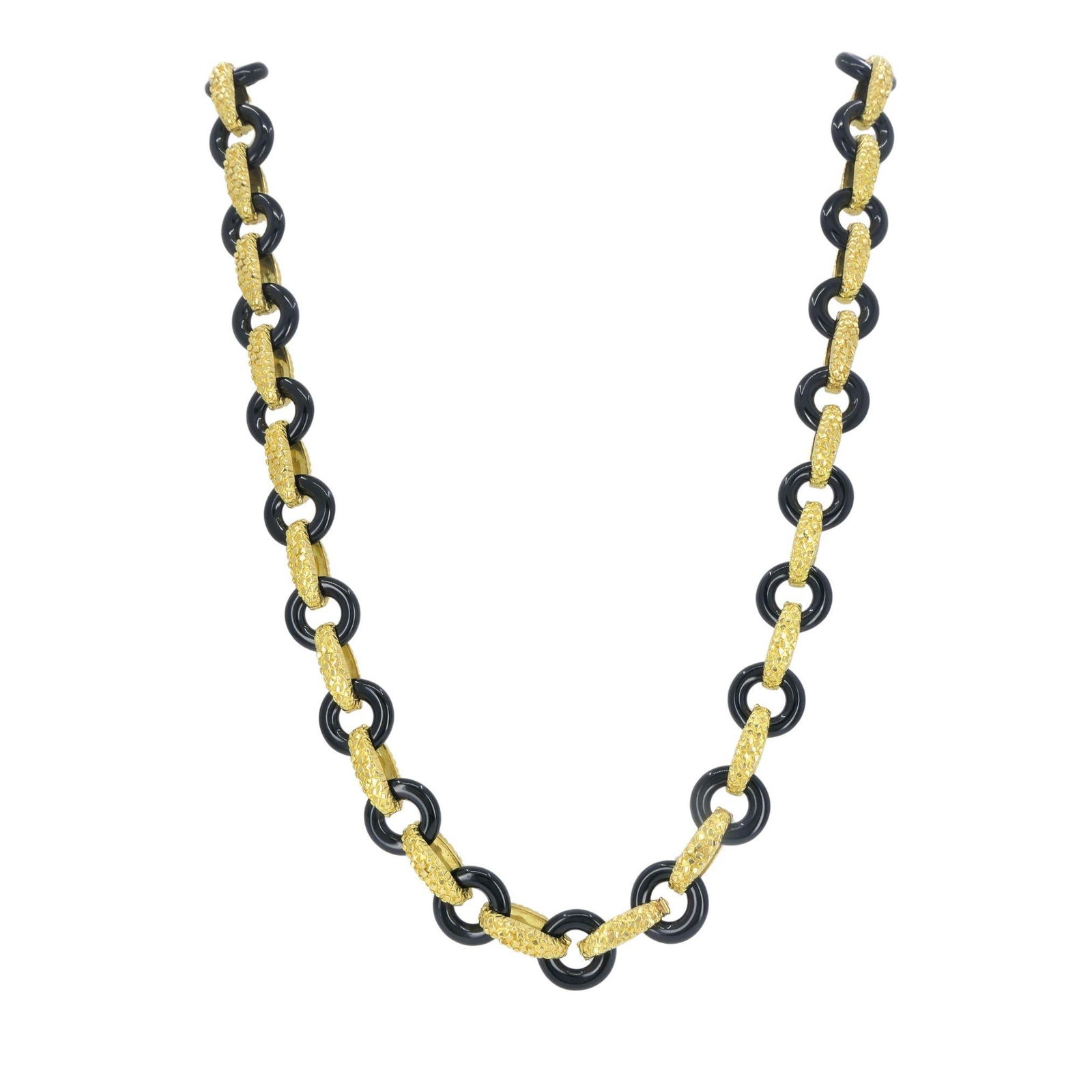 Vintage Tiffany & Co. 18k Gold Onyx Necklace: Title: Vintage Tiffany & Co. 18k Gold Onyx Necklace Description: This Tiffany & Co. onyx and 18k gold necklace reflects the bold, sculptural aesthetic the house favored in the late 1970s through the m