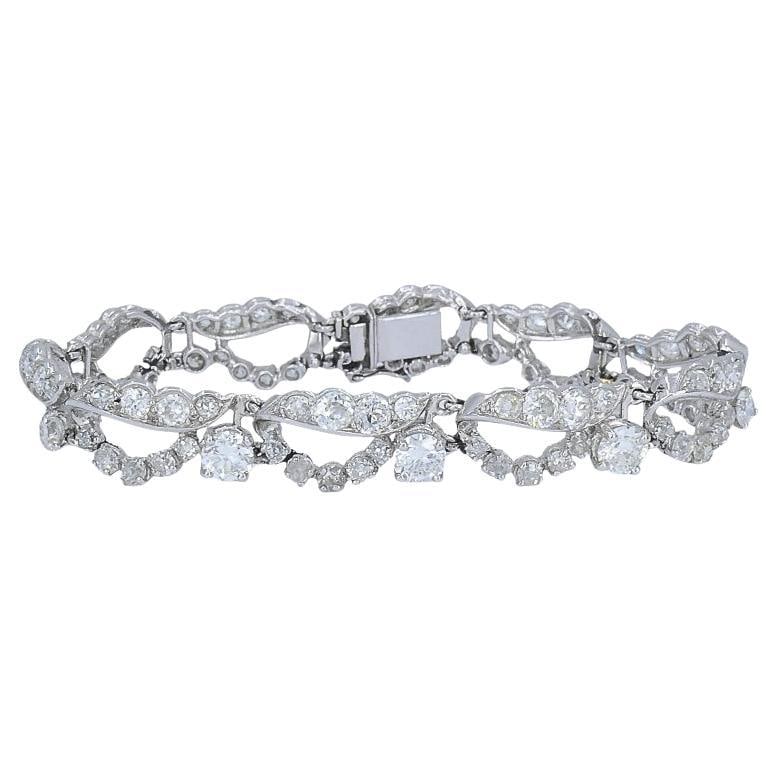 French Platinum Diamond Openwork Diamond Bracelet, 1960s: Title: French Platinum Diamond Openwork Diamond Bracelet, 1960s Description: This French platinum diamond bracelet showcases a refined openwork design that balances vintage craftsmanship with clean