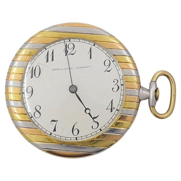 Vintage Spaulding & Gorham 18k Gold Pocket Watch: Title: Vintage Spaulding & Gorham 18k Gold Pocket Watch Description: This vintage Spaulding & Gorham 18K pocket watch features a distinctive striped case in yellow, rose, and white gold with a plain c