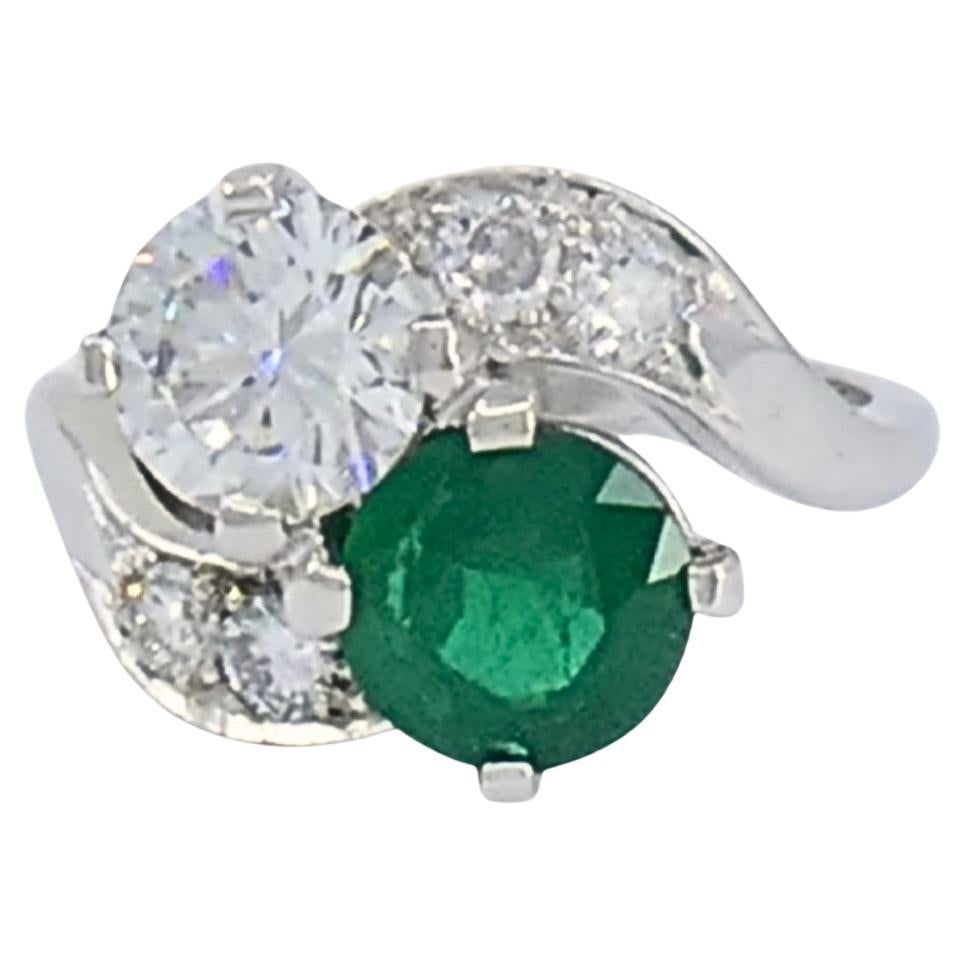 Vintage Platinum Toi et Moi Engagement Ring Diamond Emerald: Title: Vintage Platinum Toi et Moi Engagement Ring Diamond Emerald Description: This vintage platinum ring is designed in the classic Toi et Moi style, pairing a diamond and an emerald in a balanced,