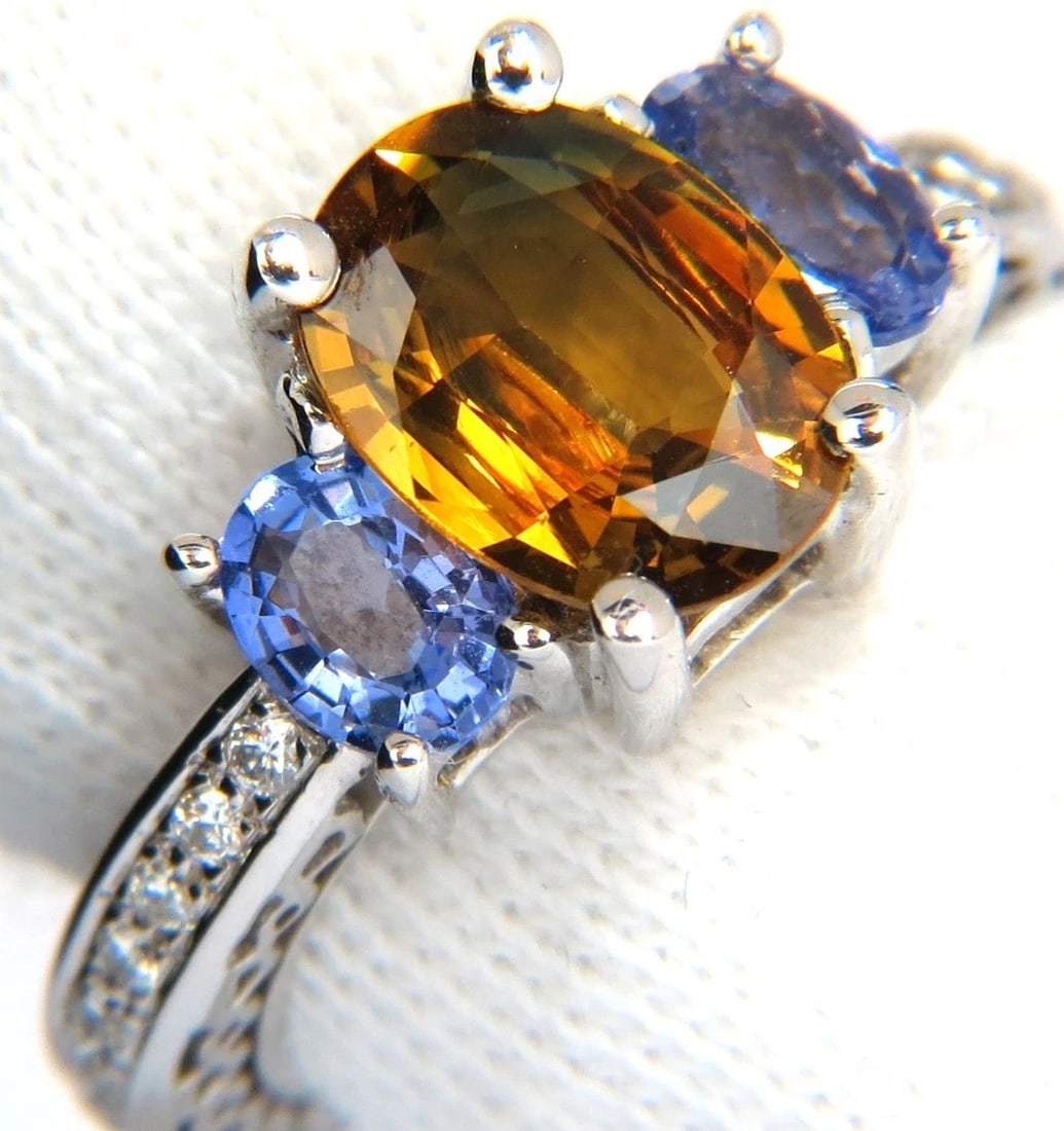 3.68CT NATURAL FANCY VIVID YELLOW BROWN SAPPHIRE TANZANITE DIAMONDS RING 14KT+: Title: 3.68CT NATURAL FANCY VIVID YELLOW BROWN SAPPHIRE TANZANITE DIAMONDS RING 14KT+ Description: 2.28ct Natural Sapphire & Tanzanite ring. Sapphire of beautiful Fancy Vivid Yellow Brown. VS- Clean C