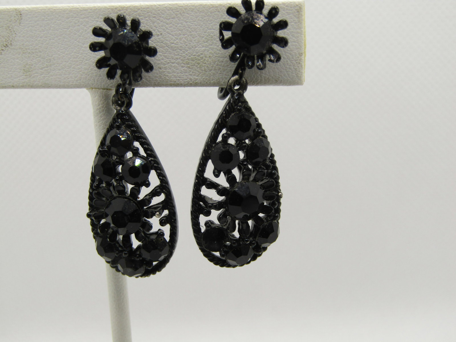 Vintage Black Rhinestone Stud & Dangle Earrings, Clip: Vintage Black Rhinestone Stud & Dangle Earrings, Clip, black enameled with a blossom stud with black rhinestone and a teardrop dangle with rhinestones and open work. They came in an estate lot with mo
