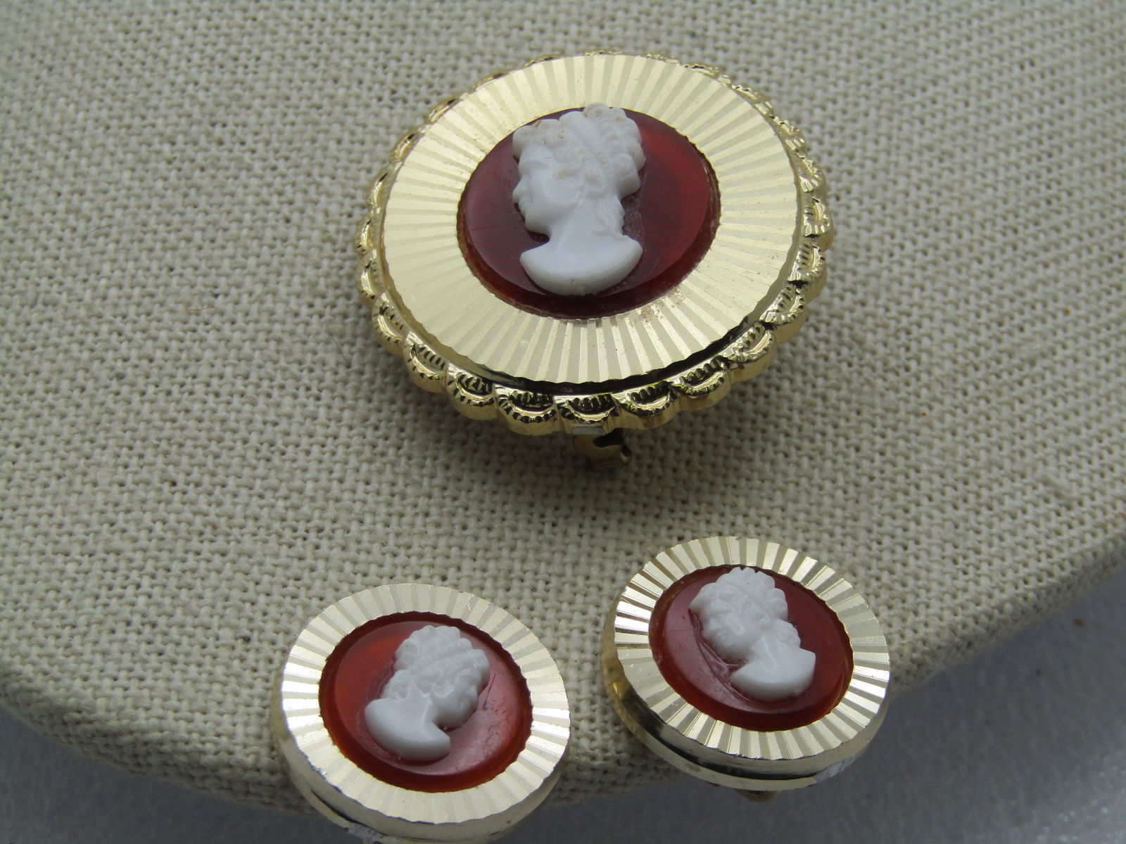 Vintage Cameo Brooch & Earrings Set, Clip, 1950's-1960's, W. Germany.: Vintage Cameo Brooch & Earrings Set, Clip, 1950's-1960's. This has a ridged frame around the molded plastic honey background and white cameo with a scalloped edge on the brooch. The brooch is