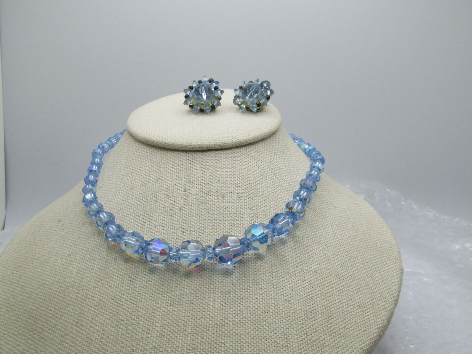 Vintage Blue Graduated AB Crystal Necklace/Earrings, 1940's-1960's: Vintage Blue Graduated AB Crystal Necklace/Earrings, 1940's-1960's. The earrings are signed Lisner. The encklace is not signed. It is 16" with graduated beads from 6mm to appx. 12mm. Hook clasp. The e