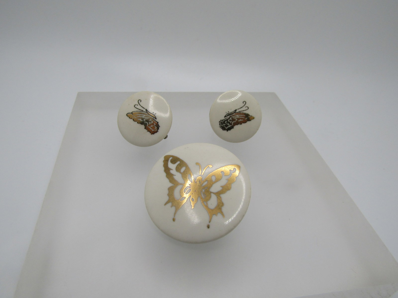 Vintage Ceramic Gold Butterfly Brooch & Earrings, Screwback, 1960's-1970's: Vintage Ceramic Gold Butterfly Brooch & Earrings, Screwback, 1960's-1970's. Glazed white round discs with a gold leaf decal butterfly on the brooch - open wings and appx. 1.25" across. The hearrings h