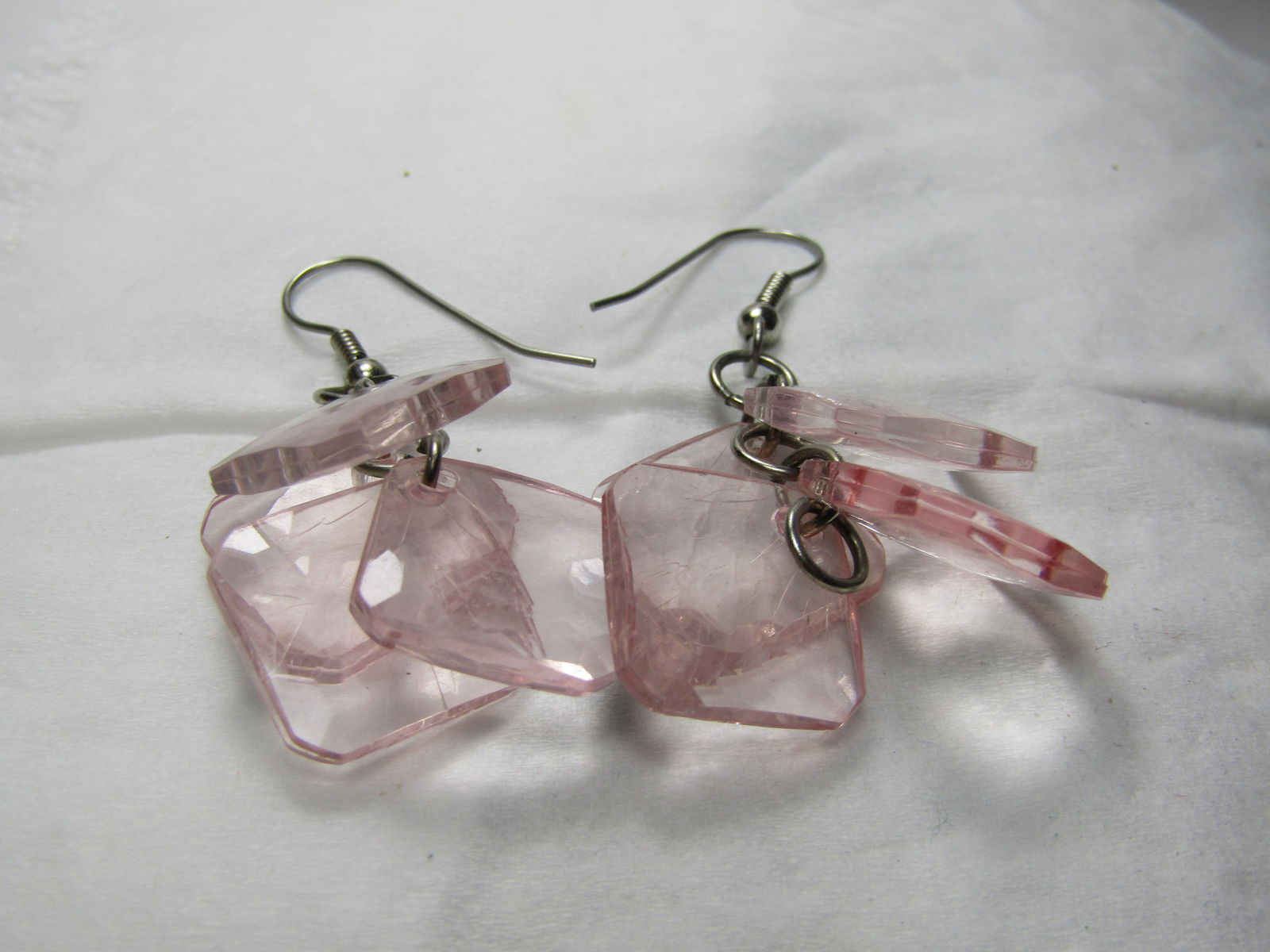 Vintage Pink Faceted Dangle Earrings, Pierced, 2": Vintage Pink Faceted Dangle Earrings, Pierced, 2". These have clear faceted pink lucite dangle discs on hook post. They are each about 5/8" square with cut corners. Silver tone. Good condition, light