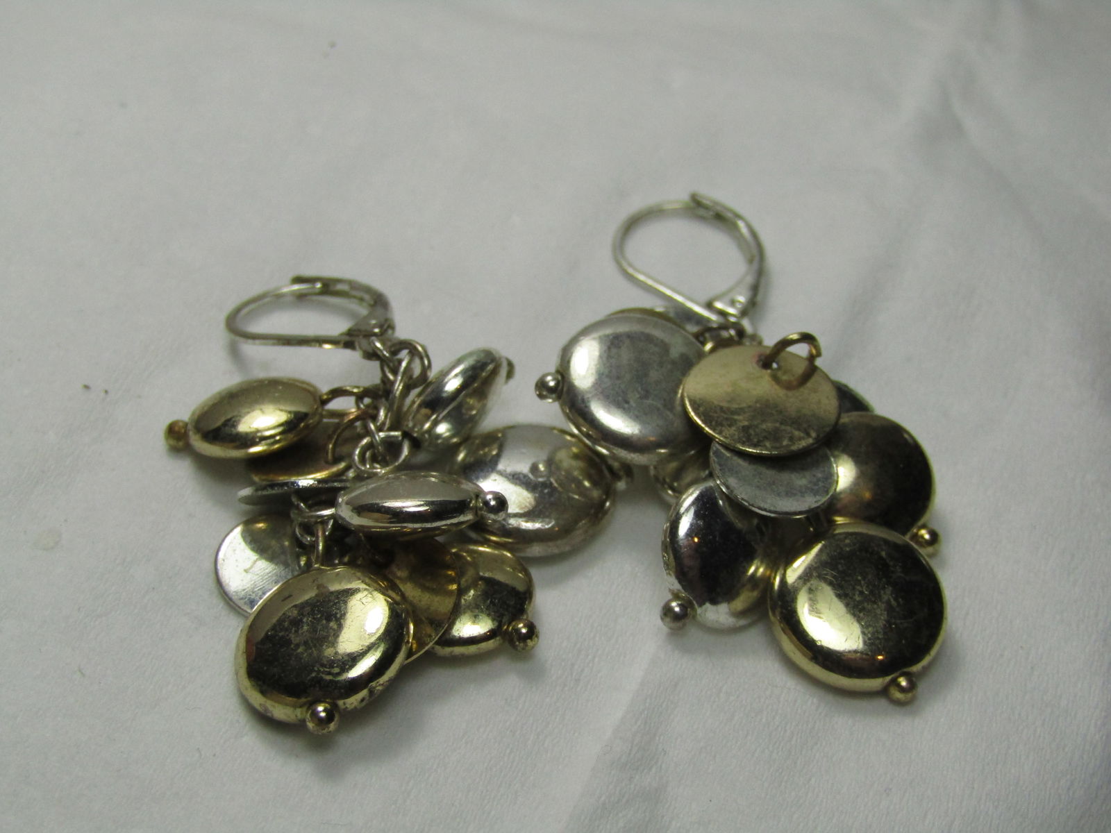 Vintage Two-Tone Dangle Leverback Earrings, Pierced, 2" Dangle: Vintage Two-Tone Dangle Leverback Earrings, Pierced, 2" Dangle. Round silver tone and gold tone puffy hollow disc-like beads and flat dangles. Pierced, Leverback. Not signed by the maker. 1980's-1990'