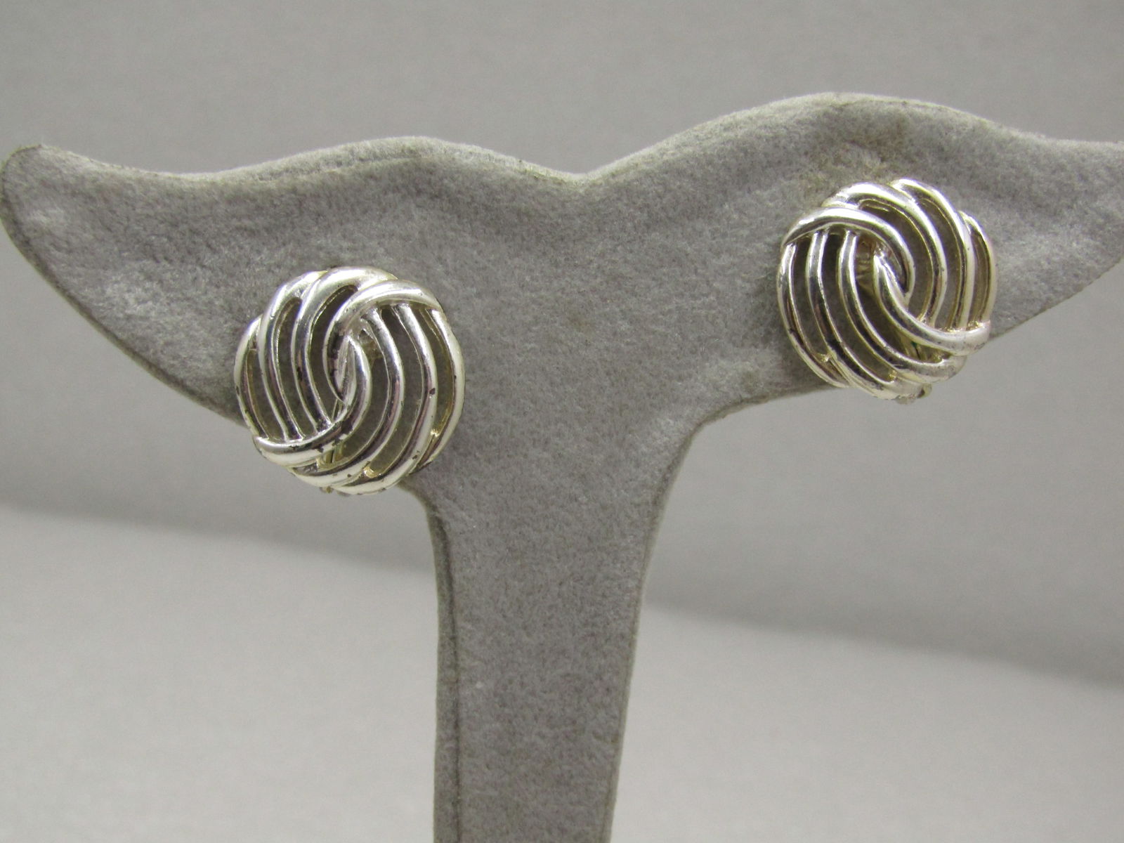 Vintage Monet Open Weave Clip Earrings: Vintage Monet Open Weave Clip Earrings, SIlver Tone, 3/4". They are signed Monet . Age is appx. 1980's-1990's. Very good condition. (INV. W. 6521.5 SS5017 J LD 7/24/21). Reserve: $30.00 