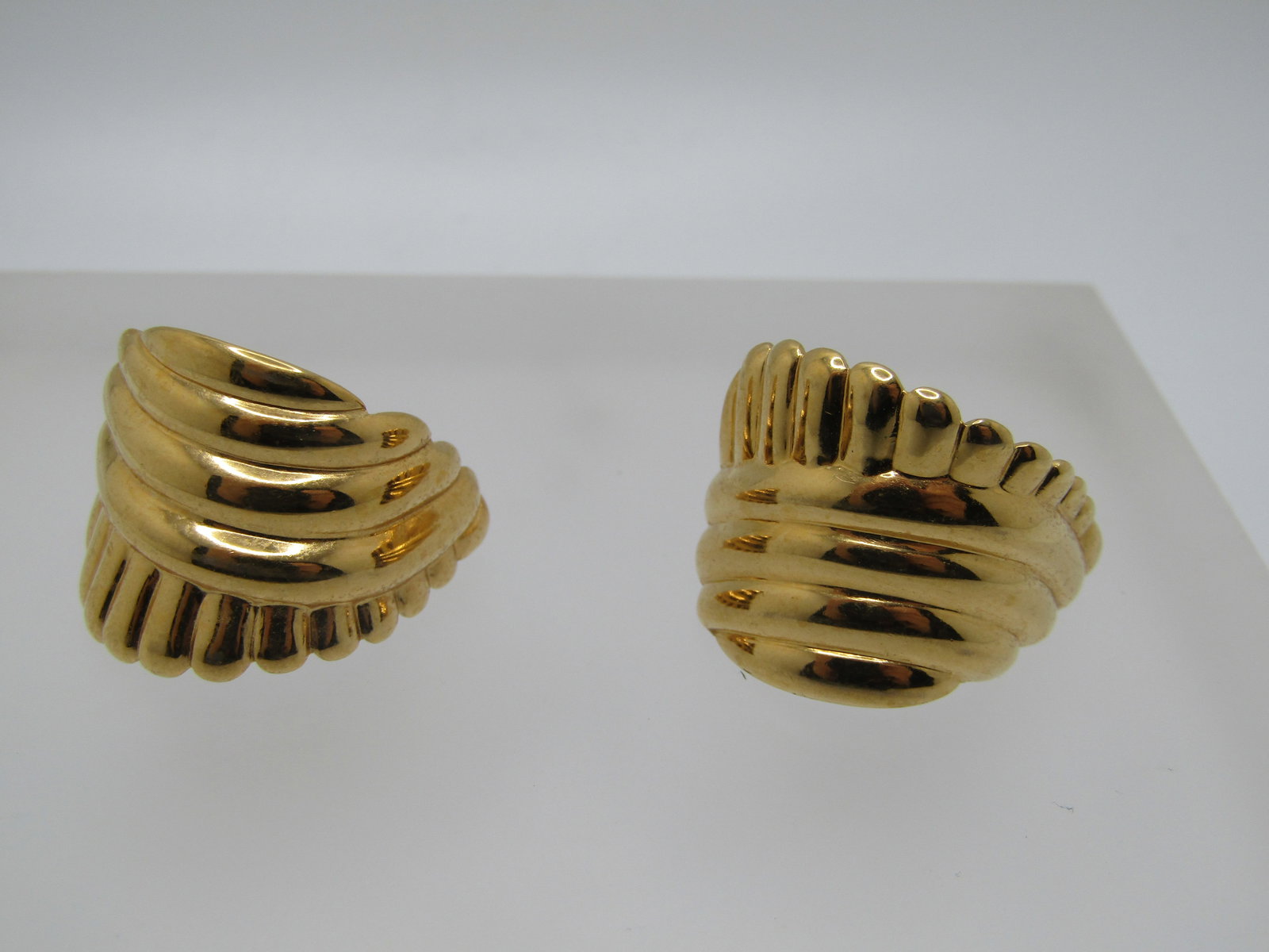 Vintage Monet Ridged Half-Hoop Earrings, Pierced, Gold Tone - 1970's-1980's: Vintage Monet Ridged Half-Hoop Earrings, Pierced, Gold Tone - 1970's-1980's. These have curvesd ridged that are tapered in length going down the leght of the earigns with one edge having them go