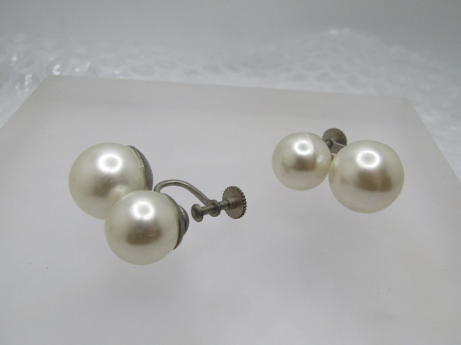 Vintage Double Faux Pearl Earrings, Japan, Screw Back, 1950's: Vintage Double Faux Pearl Earrings, Japan, Screw Back, 1950's. The pearls are appx. 11.5mm and 13.5mm - the top one is slightly smaller than the bottom. Silver tone setting and signed Japan on the