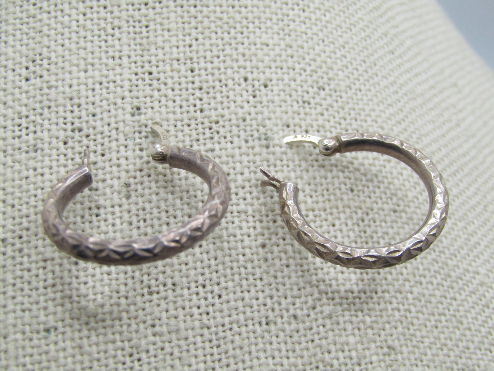 Vintage Sterling Notched Hoop Earrings, Pierced, 1970's-1980's, Signed: Vintage Sterling Notched Hoop Earrings, Pierced, 1970's-1980's, Signed with what looks like an A - hinged post that locks . Marked .925 and tests as sterling with a weight of appx. 1.41 gr. They are a