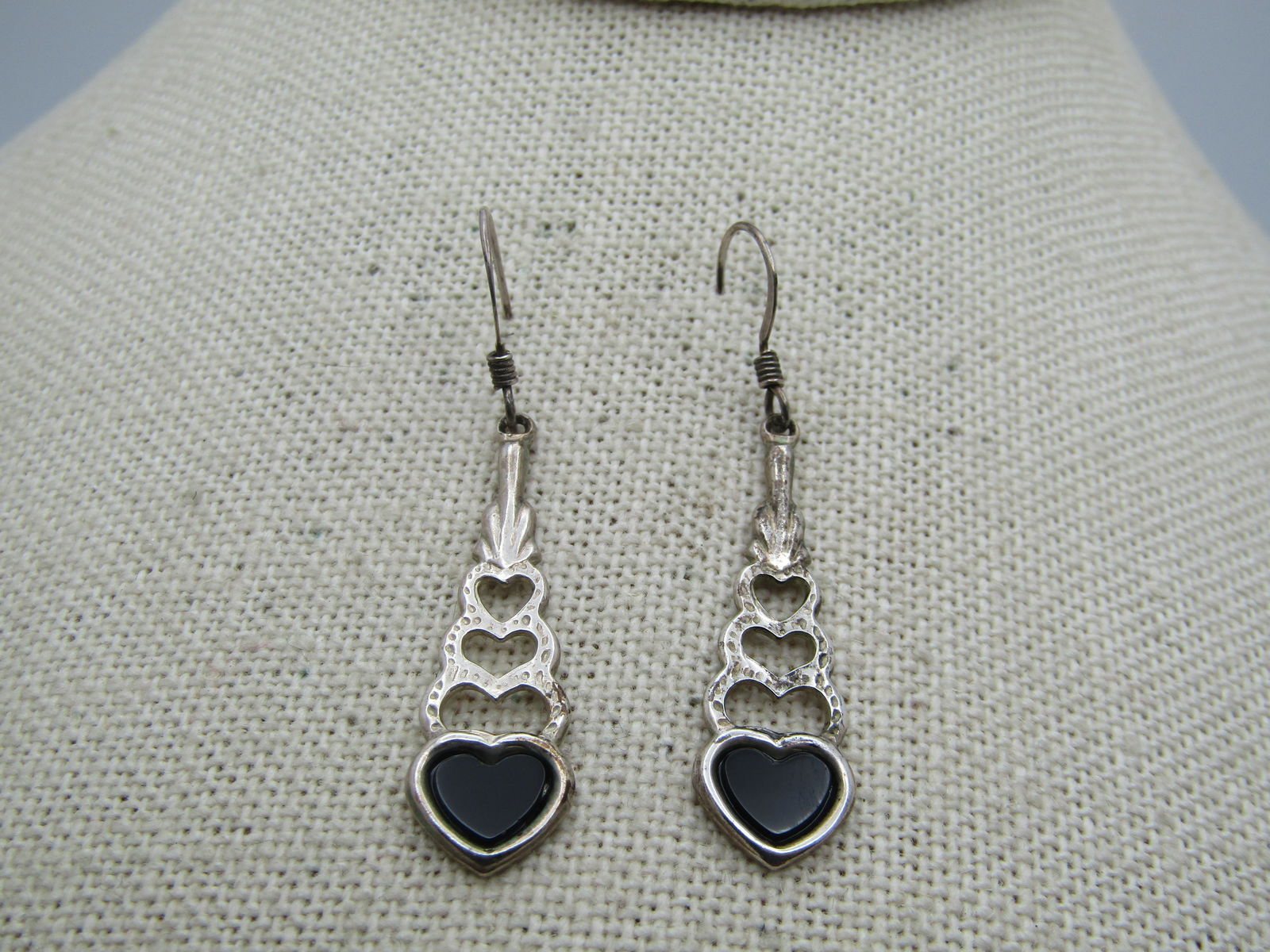 Vintage Sterling Onyx Heart Journey Earrings, Pierced, 1980's: Vintage Sterling Onyx Heart Journey Earrings, Pierced, 1980's. These have an onyx heart at the bottom with three graduated hammered heart open framed links above it. The earrings are appx. 1.75" long