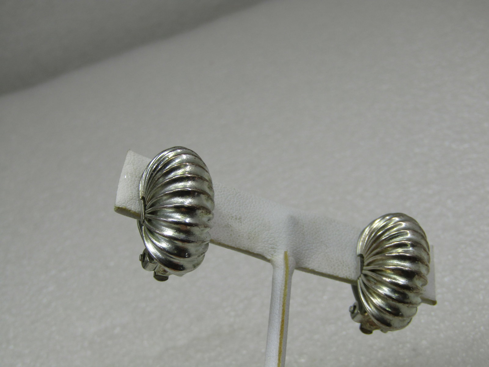 Vintage Gay Boyer Accordian Clip Earrings, Silver Tone, 1980's: Vintage Gay Boyer Accordian Clip Earrings, Silver Tone, 1980's. Half hoops that are appx. 1" long and 1/2" wide. Sturdy and strong clips that will hold. Signed Gay Boyer on the outer part of the clip.