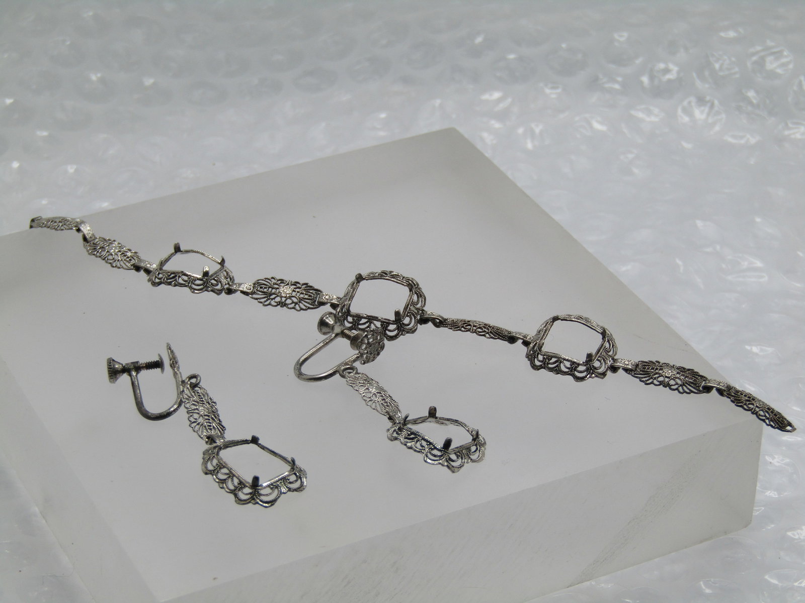 Vintage Sterling Filigree Bracelet & Earrings, Settings, Art Deco Themed: Vintage Sterling Filigree Bracelet & Earrings, Settings, Art Deco Themed. The earrings are bracelets have no stones - they would hold a rectangular stone that is appx. 9mm by 7mm in the earrings and 8