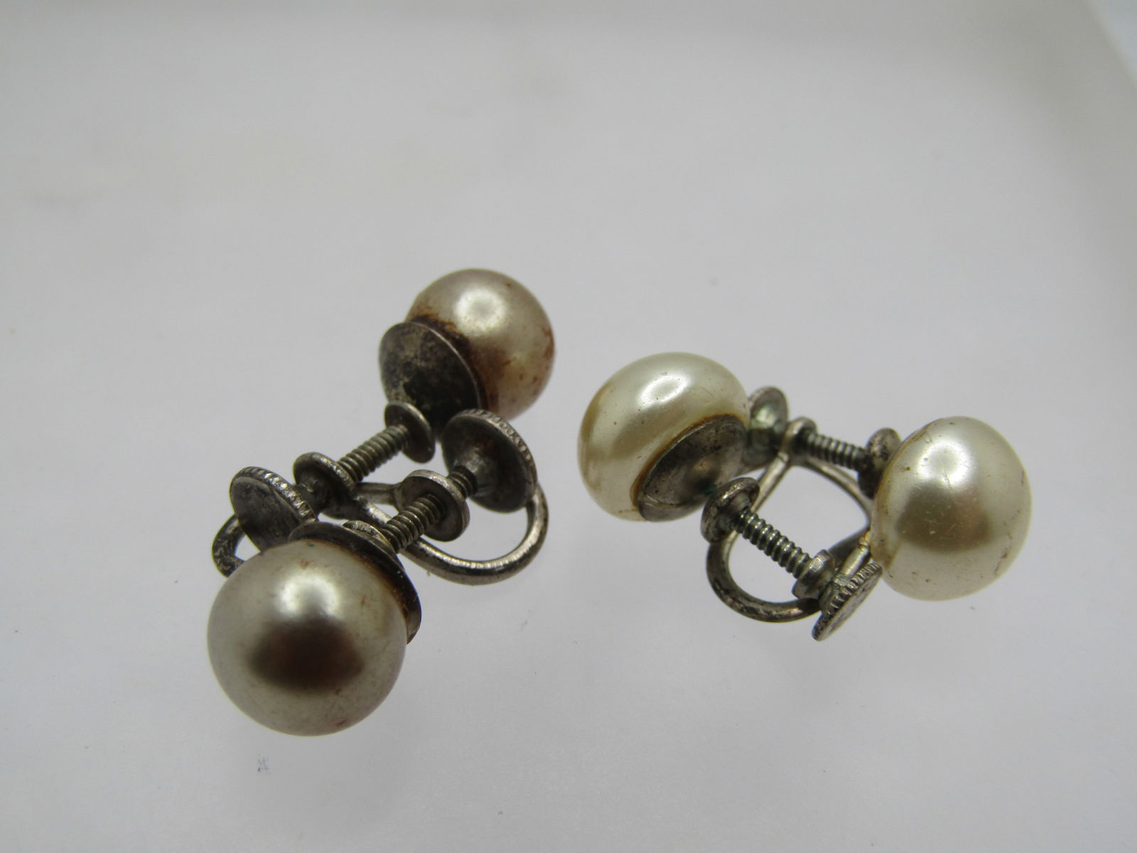 Vintage 2 Pr. Sterling Pearl Earrings, Screwback, 1930's-1940's: Vintage 2 Pr. Sterling Pearl Earrings, Screwback, 1930's-1940's. There is a more rounded blush pearl that is appx. 8mm round and marked sterling with a weight of 3.33 gr. The other is a whiter pearl t