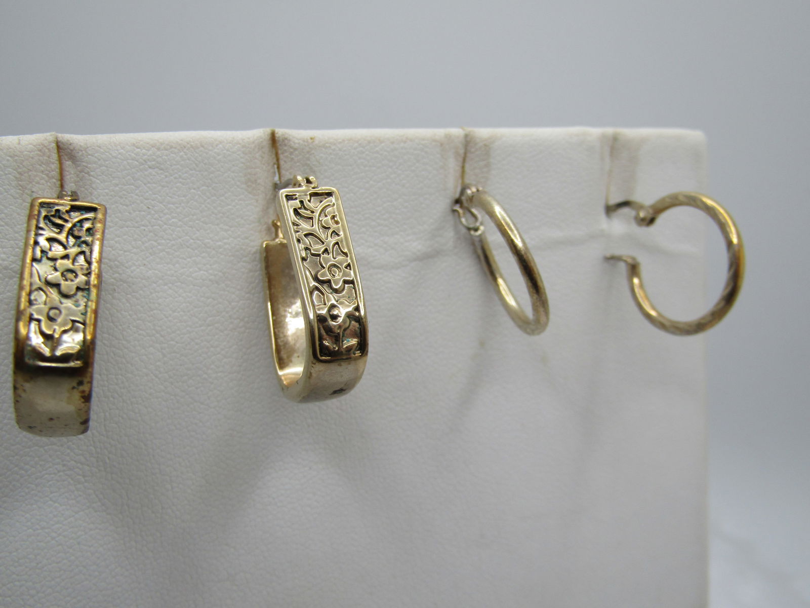 Vintage Sterling Hoop Earrings/Gold Tone Hoop Earrings, Pierced, 1980's: Vintage Sterling Hoop Earrings/Gold Tone Hoop Earrings, Pierced, 1980's. Two pair of earrings - a pair of 3/4" hoop sterling silver earrings with hinged post and locking clasp with notched design in t