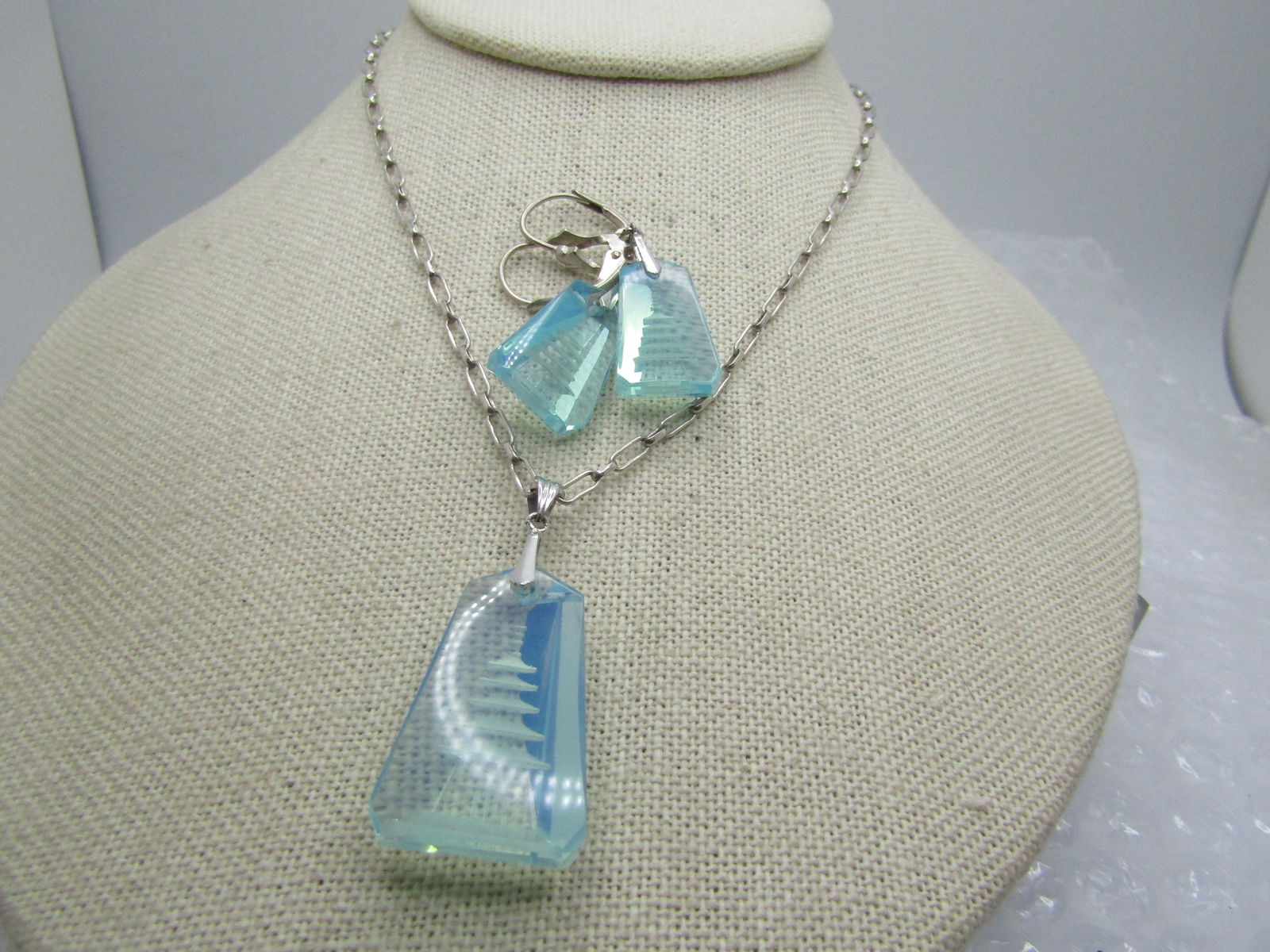 Vintage Sterling Reverse Carved Pagoda Necklace/Earrings Set, 19", Leverback, 1980's-1990's.: Vintage Sterling Reverse Carved Pagoda Necklace/Earrings Set, 19", Leverback, 1980's-1990's. Appx. sterling weight is 5.40 gr. The pendant and earrings drops are a reversed carved aqua blue glass ston