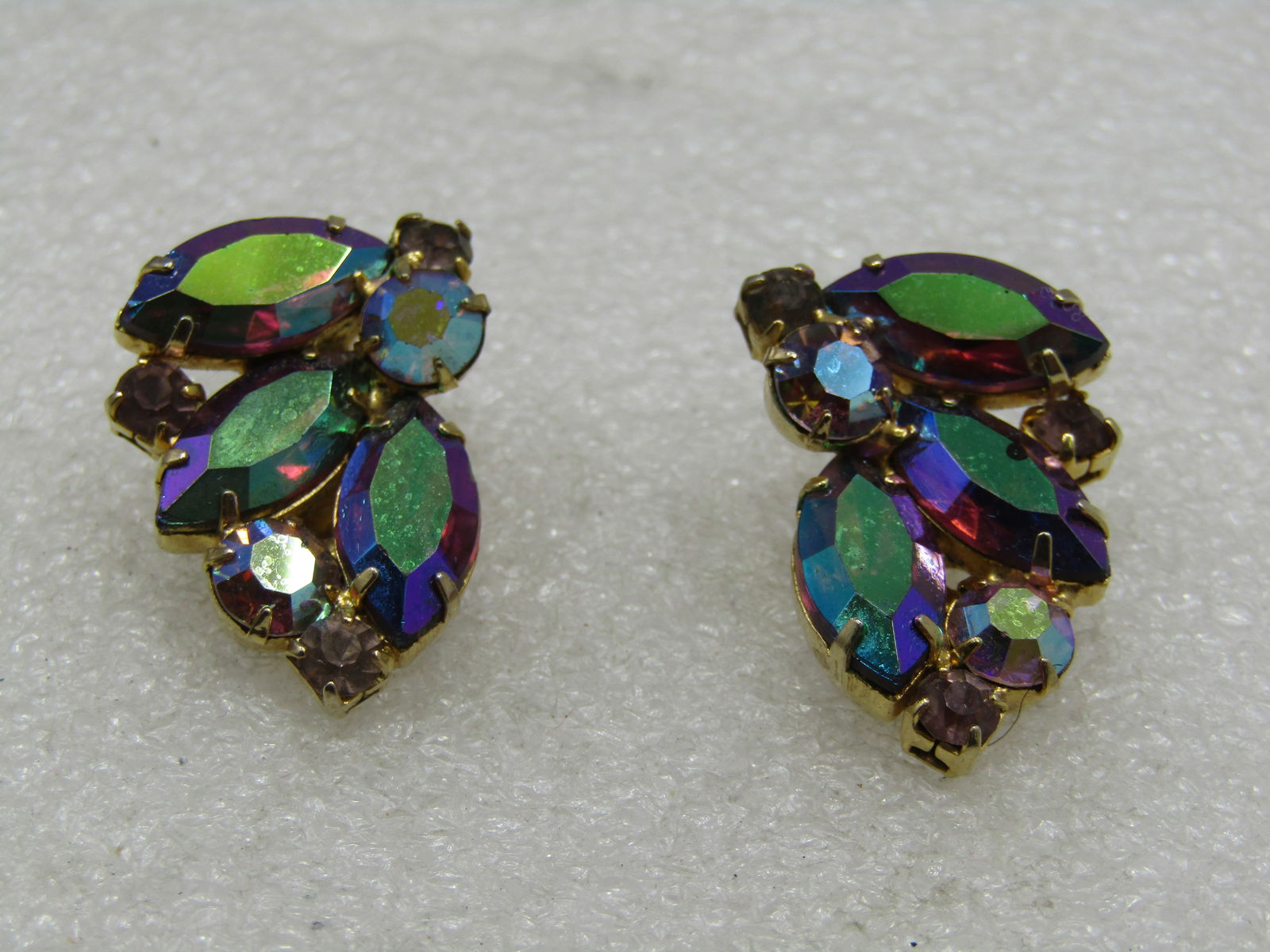 Vintage Aurora Boralis Rhinestone Clip Earrings, Peacock Hues: Vintage Aurora Boralis Rhinestone Clip Earrings, Peacock Hues, 1960's. Marquise and round stones. The round stones are more clear with the lightler peacock aurora borealis shimmer while the larger mar