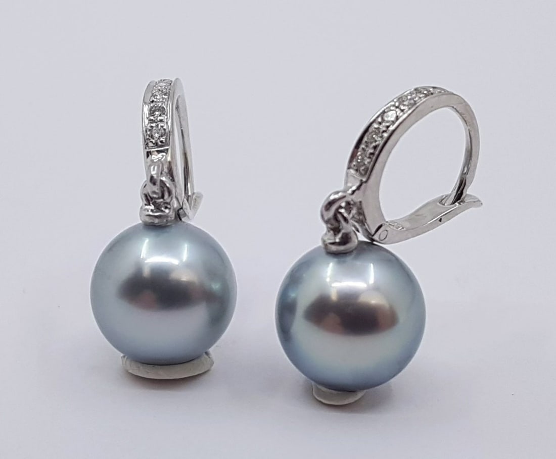 Earrings - 14 kt. White gold - 0.09ct. tw. - 9x10mm Tahitian Pearls: Title: Earrings - 14 kt. White gold - 0.09ct. tw. - 9x10mm Tahitian Pearls Description: Emerging from the tropical lagoons of French Polynesia, these Tahitian pearls have been hand selected for their