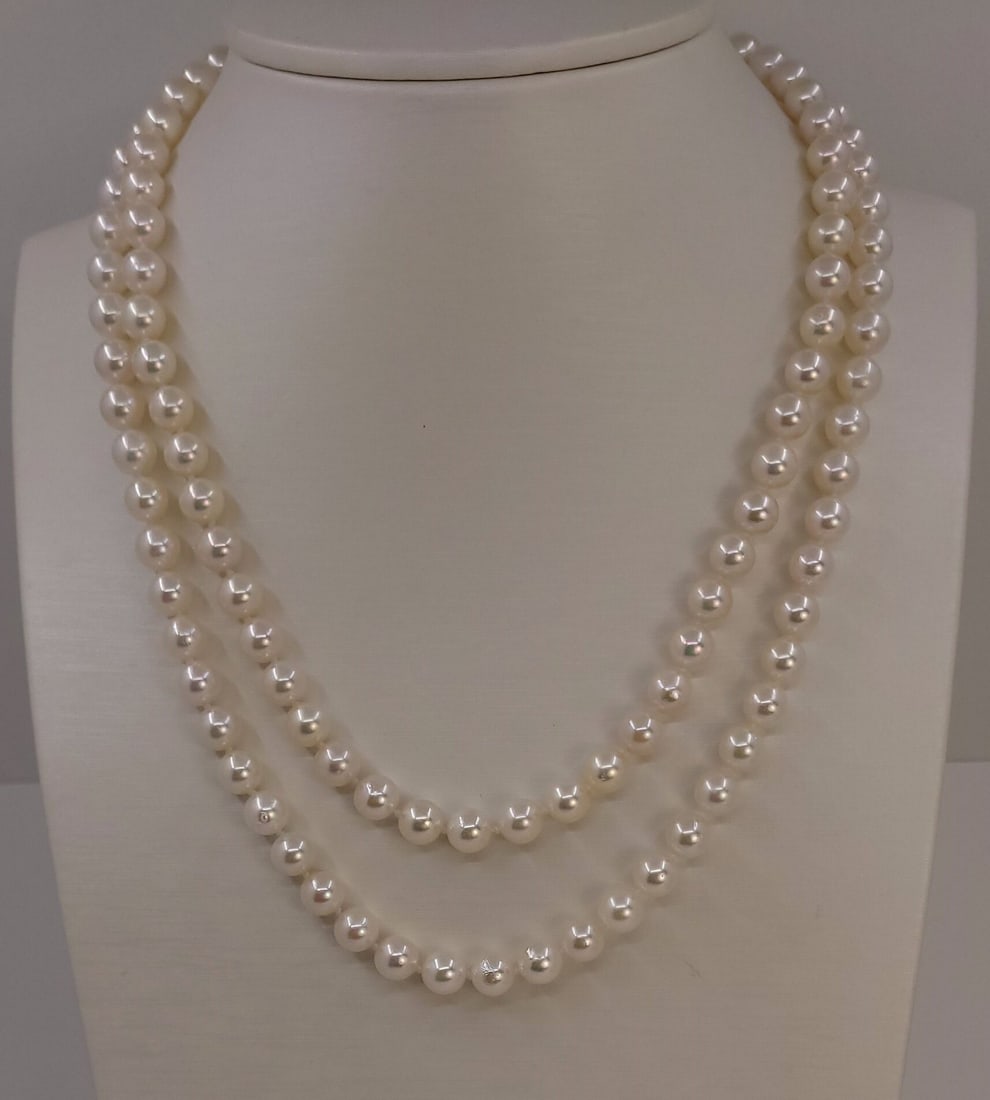 Necklace 6.5x7mm Double Akoya Pearls: Title: Necklace 6.5x7mm Double Akoya Pearls Description: A beautiful double pearl necklace of white saltwater Akoya pearls with exceptional lustre, finished with a 925 sterling silver clasp. This
