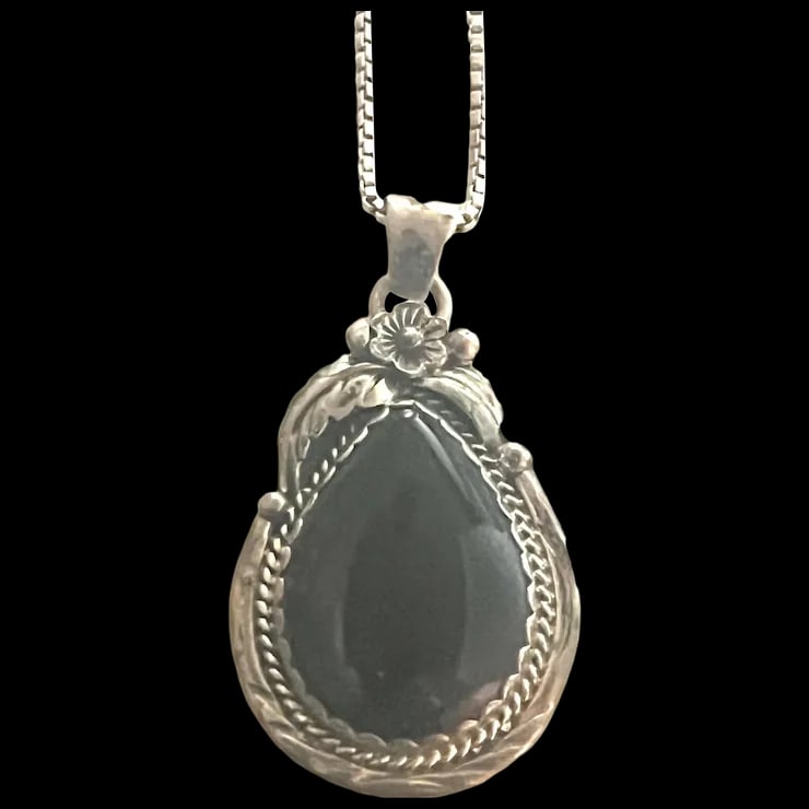 Navajo Sterling Silver and Black Onyx Necklace: Title: Navajo Sterling Silver and Black Onyx Necklace Description: Navajo Sterling Silver and Black Onyx NecklaceHallmarked: SN925Weighs 14.2 gramsPendant Measures Approx. 1.75 x 1 inch Chain Measures