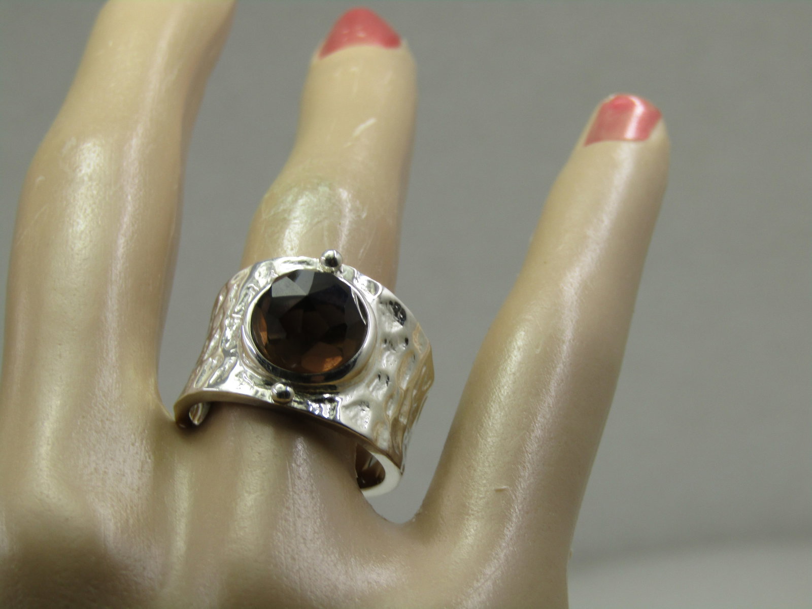 Sterling Smoky Topaz Wide Hammered Band Ring, Sz. 8,: Sterling Smoky Topaz Wide Hammered Band Ring, Sz. 8, Signed with a mark that includes a triangular and A inside that and other marks that cannot be determined. The faceted smoky topaz is appx. 9.5mm
