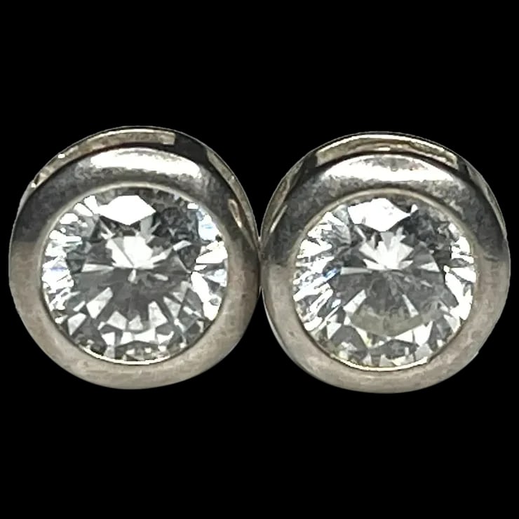 Vintage Sterling Silver CZ Stud Earrings: Title: Vintage Sterling Silver CZ Stud Earrings Description: Vintage Sterling Silver CZ Stud EarringsDid not see a Hallmark- Test as Sterling Silver Pierced EarringsWeighs 1.5 gramsMeasures Approx.