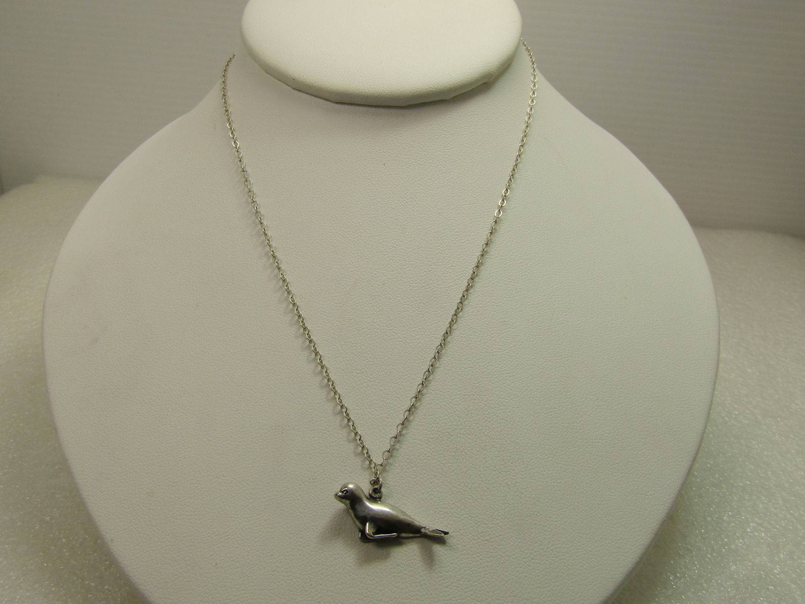 Vintage Sterling Seal Necklace, 16", 1970's-80's, Signed: Vintage Sterling Seal Necklace, 16", 1970's-1980's, Signed. This is a sterling seal pendant, smooth and 3-D on the front. It is appx. 1" wide and 1/2" tall at the bail. It is marked .925 and