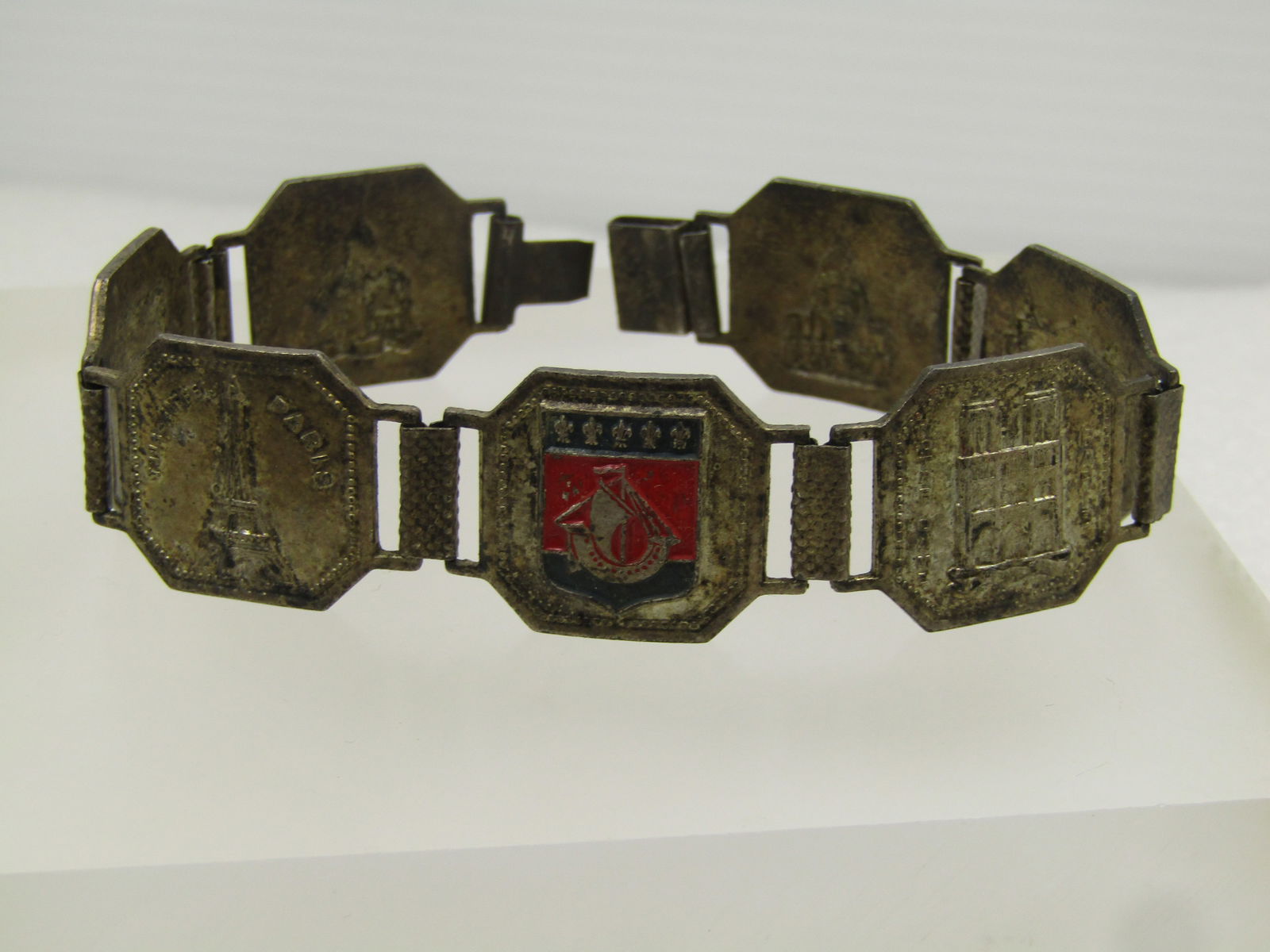 Vintage Silver Tone Paris Tiled Bracelet , 8", Mid-Century: Vintage Silver Tone Paris Tiled Bracelet , 8", Mid-Century. These needs a new clasp or a tab that goes into the box clasp. Sold as is. One tile is enameled in red and blue. There are seven tiled,