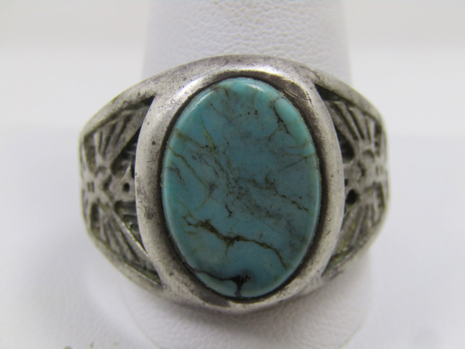 Vintage Sterling Southwestern Turquoise Thunderbird Ring, Sz. 15, 1970's-1980's, Signed WM: Vintage Sterling Southwestern Turquoise Thunderbird Ring, Sz. 15, 1970's-1980's. This has an oval turquoise cabochon that is appx. 18mm by 12.5mm set into a recessed frame. On each side of the wide