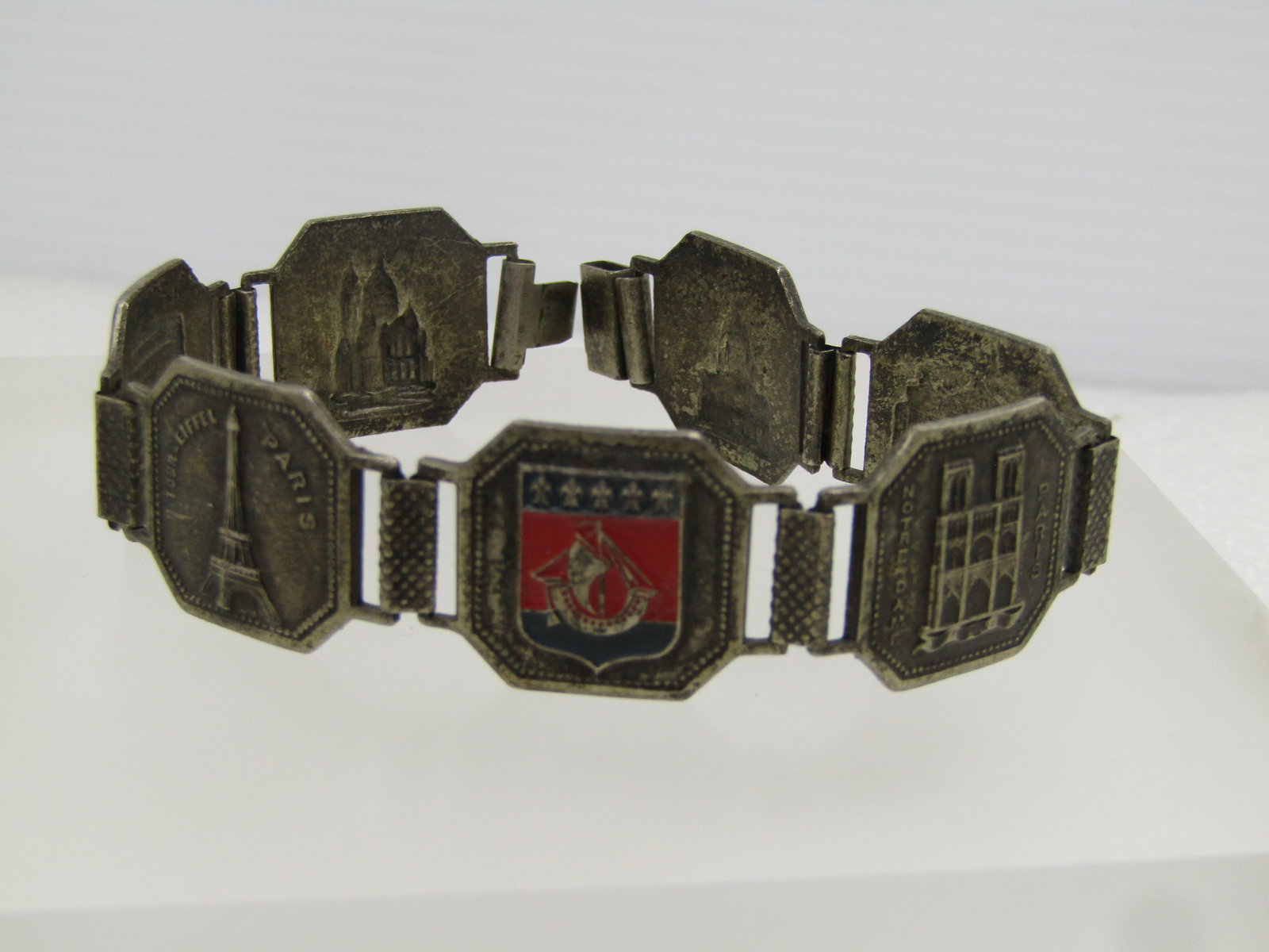 Vintage Silver Tone Paris Tiled Bracelet , 8", Mid-Century: Vintage Silver Tone Paris Tiled Bracelet , 8", Mid-Century. These needs a new clasp or a tab that goes into the box clasp. Sold as is. One tile is enameled in red and blue. There are seven tiled, each