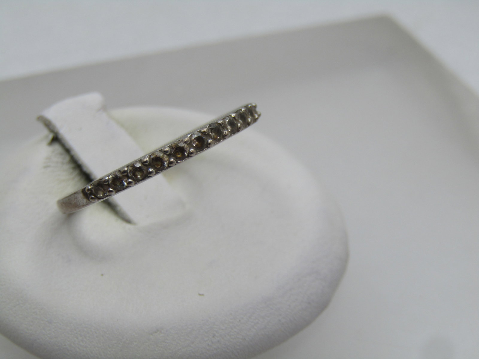 Vintage Sterling Clear Stone Ring, Sz. 8.5, 1960's-1970's: Vintage Sterling Clear Stone Ring, Sz. 8.5, 1960's-1970's. This is an anniversary style ring or wedding band with appx. eleven clear 1mm to 1.5mm stones set over the top of the finger. They are glass