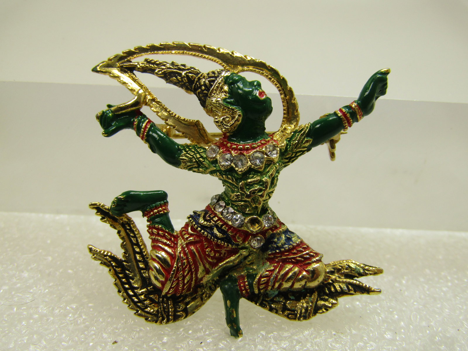 Vintage Enameled Siam/Taiwan Goddess Brooch, Red/Green/Black, 1970's-1980's: Vintage Enameled Siam/Taiwan Goddess Brooch, Red/Green/Black, 1970's-1980's. This is enameled in green and red with black around the lower waist and clar rhinestones at the neck and belt area. Two