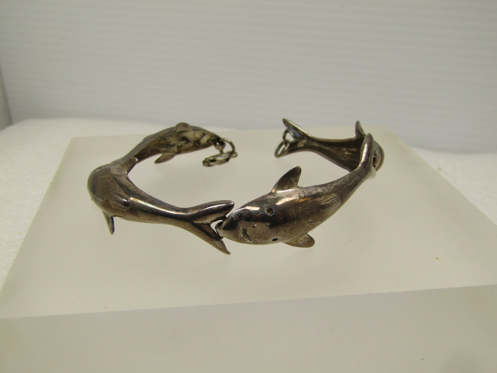 Vintage Sterling Silver Four Dolpin Link Bracelet, 7", 1980's: Vintage Sterling Silver Four Dolpin Link Bracelet, 7", 1980's. It is marked .925 on the lobster clasp and tests as sterling with an appx. weight of 13.15 grams. The dolphins are in an arched