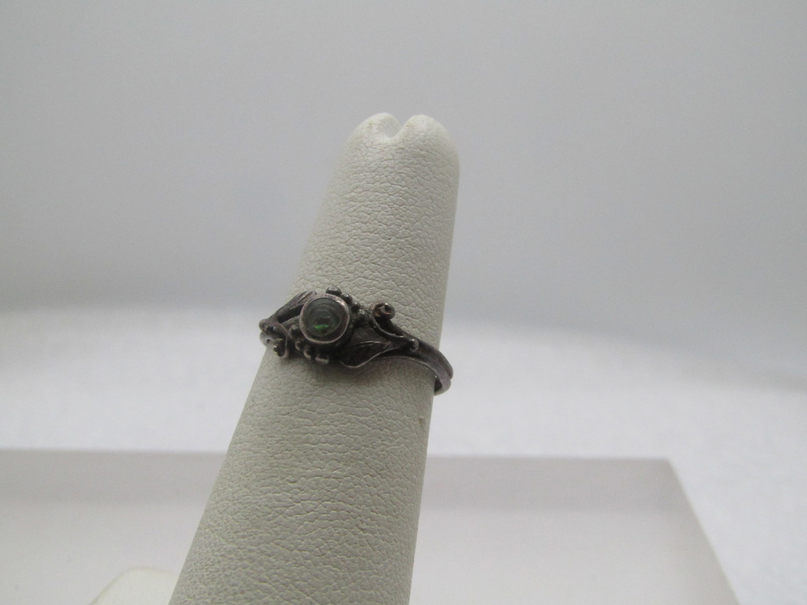 Vintage Sterling Abalone Ring, Southwestern, Sz. 5, 1960's-1970's: Vintage Sterling Abalone Ring, Southwestern, Sz. 5, 1960's-1970's. It has a round bezel-set apx. 3.5mm abalone stone in the center with an open area to each side with leaf and beaded accents. The