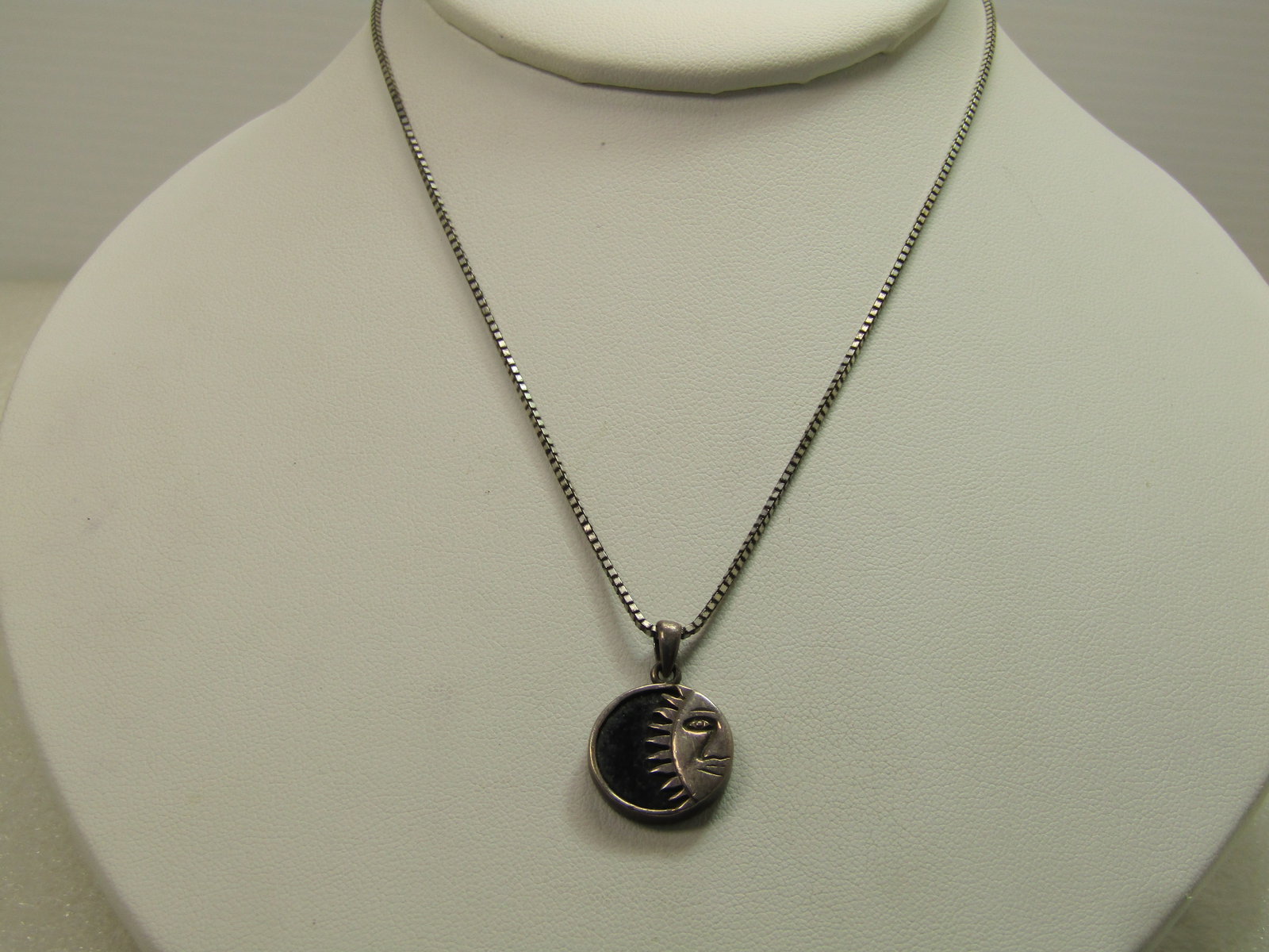Vintage Sterling Sunface Necklace, 22", 1980's-1990's, Signed: Vintage Sterling Sunface Necklace, 22", 1980's-1990's, Signed HAN. Celestial Design. This has half of a sun face with rays set over a base of black glass, framed with a sterling frame and bail. This